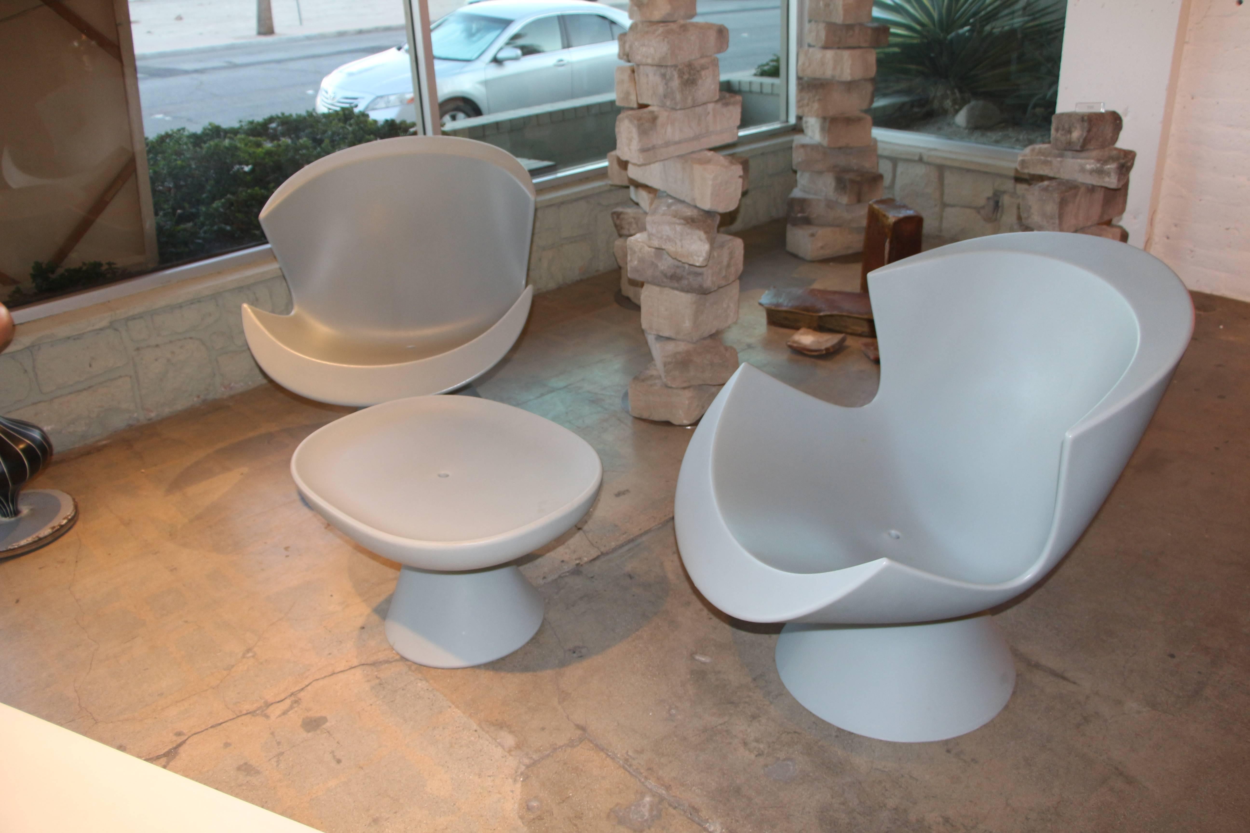 Karim Rashid designed these Kite Chairs and Mini Kite ottoman for Label of the Netherlands in 2004. They were sold I believe through DWR and are no longer in production. As Karim Rashid's fame has grown as a designed I Believe these chairs will only