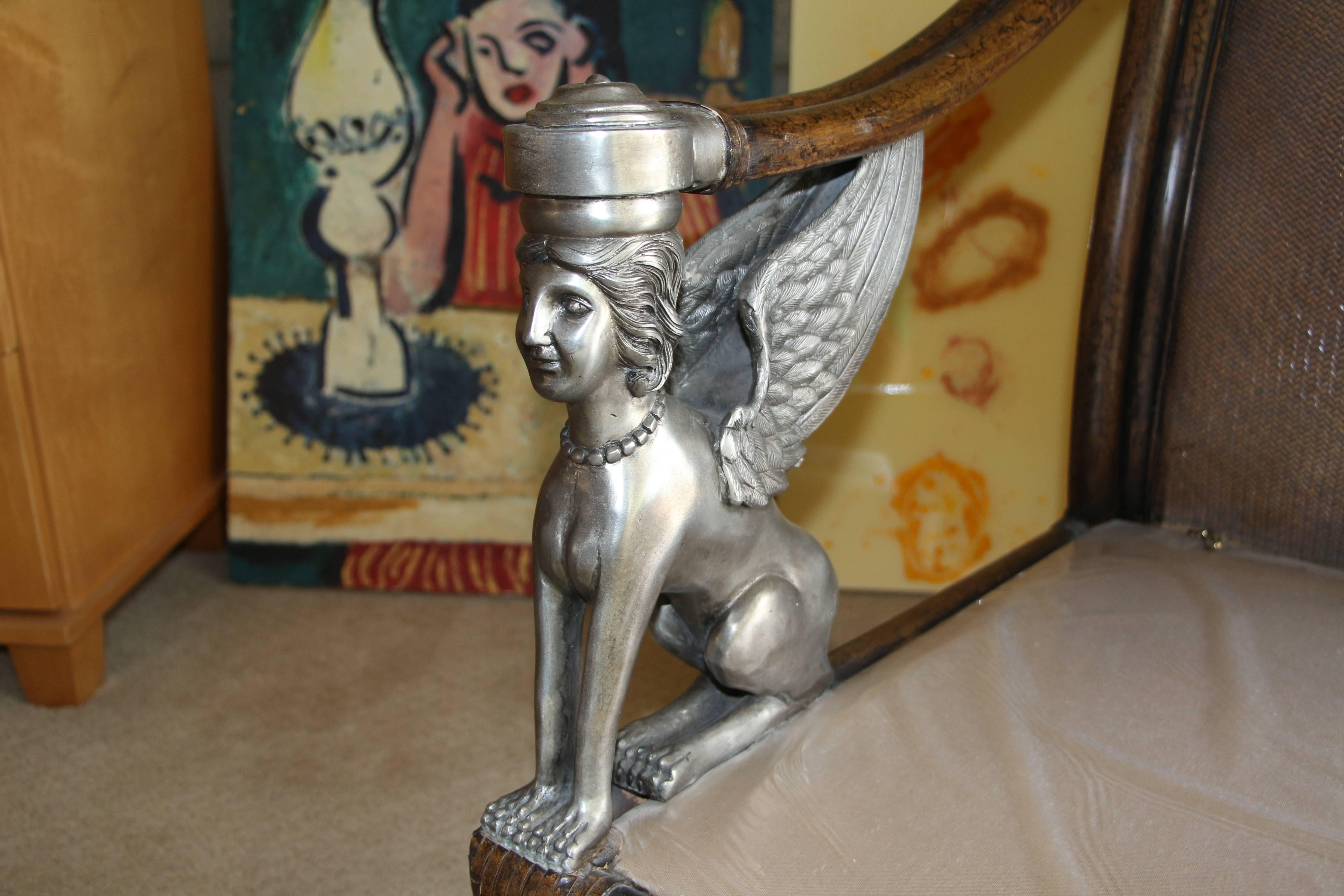 Egyptian Revival Cane and Leather Armchair with Sphinx Arms In Good Condition In Palm Springs, CA