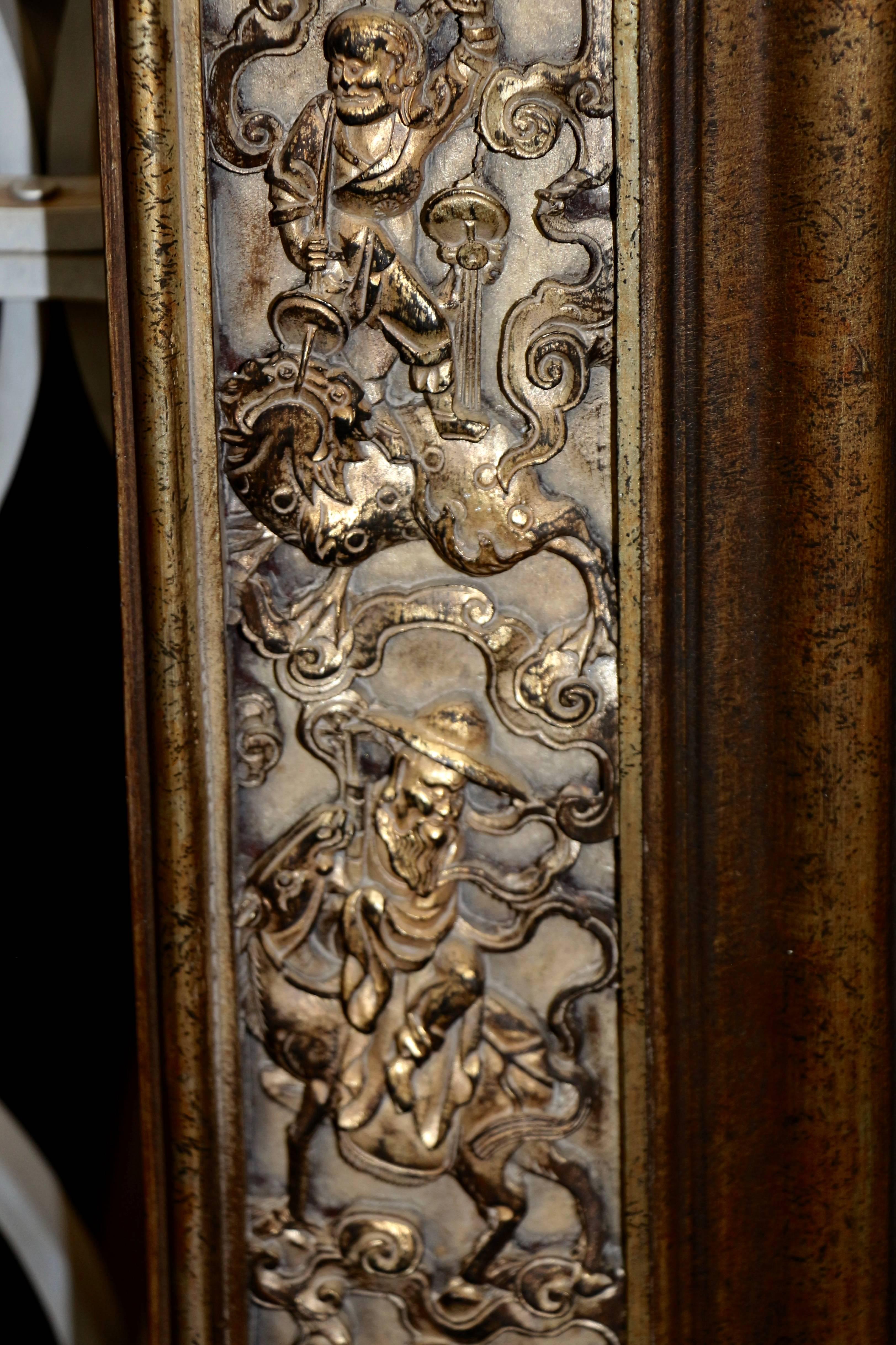 A really wonderful La Barge mirror with an Asian motif. I have seen a lot of La Barge mirrors although they are usually églomisé finished or in interesting bronze frame. This is the first one we have come across with a craved wood motif with such