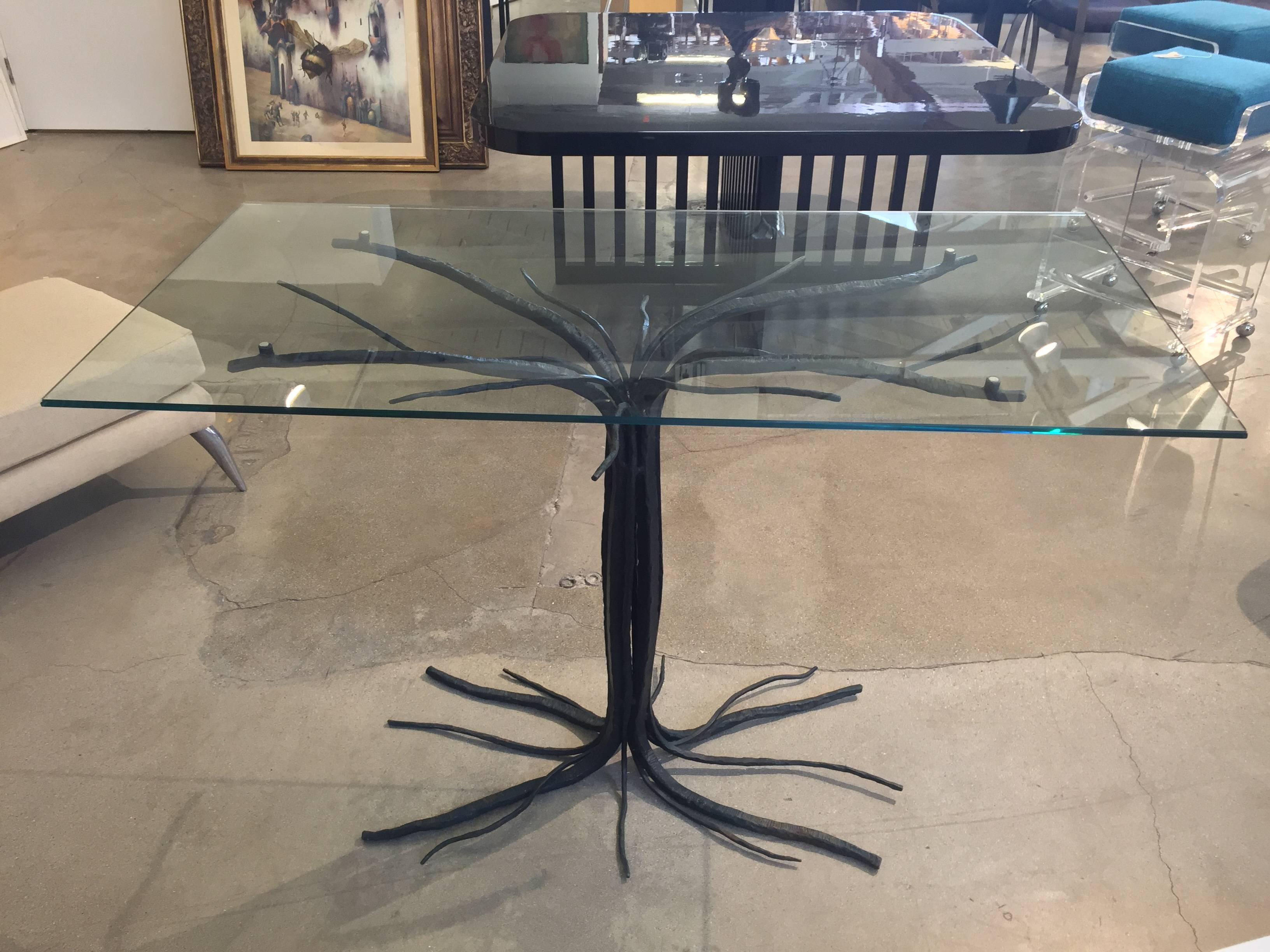 A great looking iron twig or branch table with a glass top. A very elegant design.