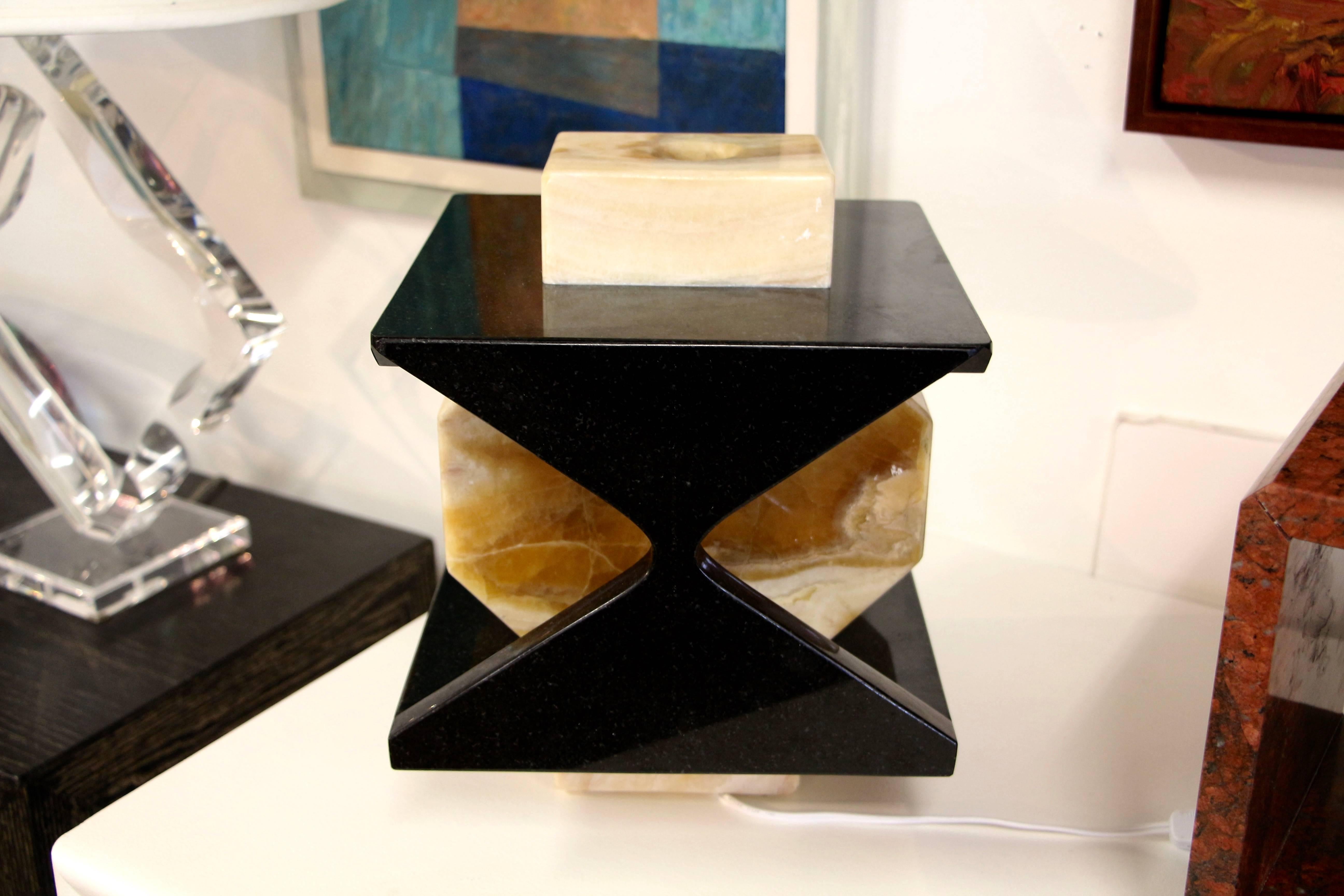 We recently started buying from a local artist Carlos Gaona, who is wonderfully talented. This lamp is a one-of-a-kind piece and is quite lovely. It is a nicely colored onyx and granite. New wiring of course.