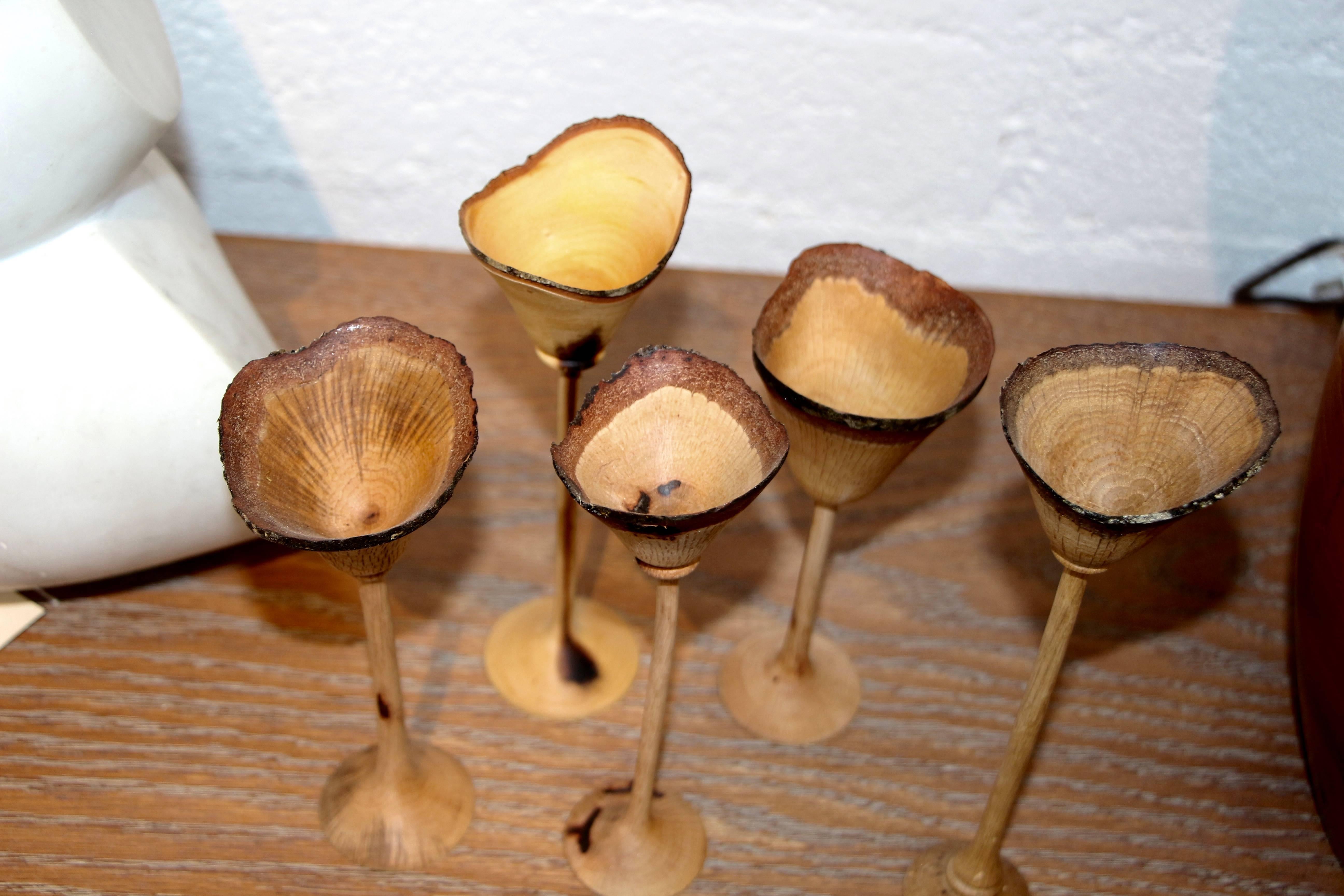 An exquisite set of six cups hand-turned by the noted northern California wood worker Paul Maurer. The tallest cup is approx 8.5 inches and the smallest is approx 6 inches tall. There diameter is approx 2.75 inches at the widest point.