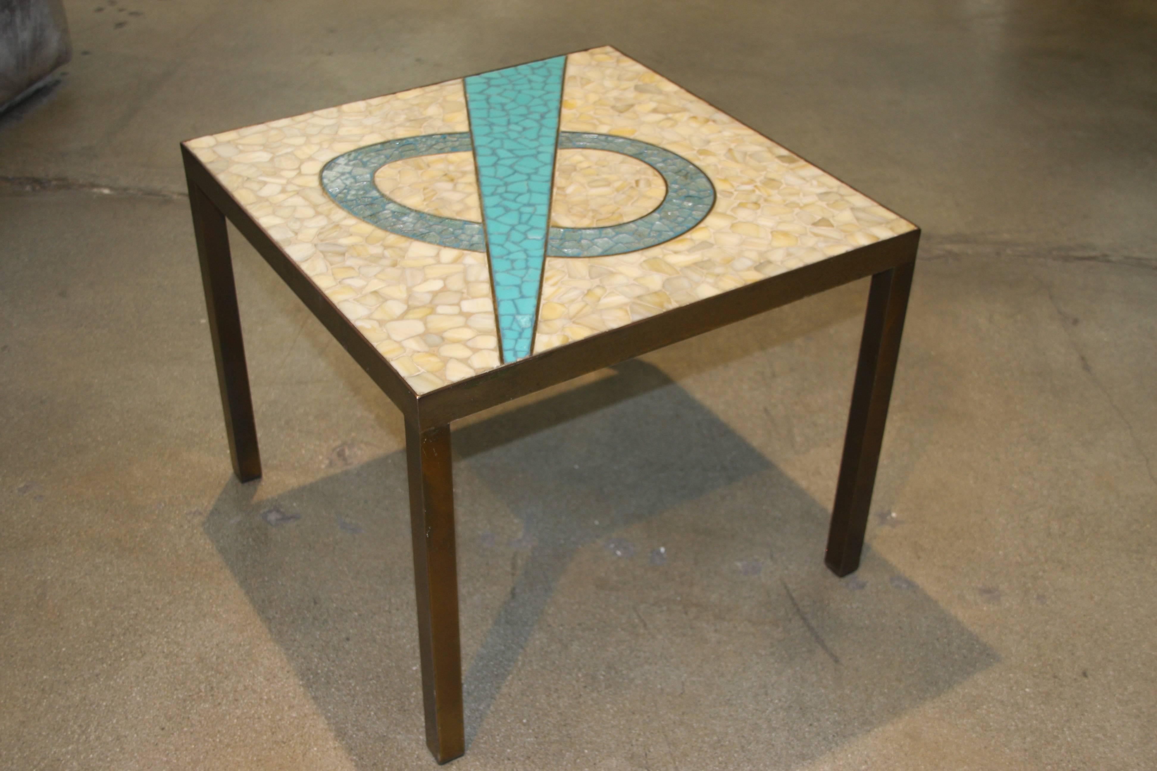 A very nice little table with a inset tile top and a bronze patinated frame. Nice design to the tile top.