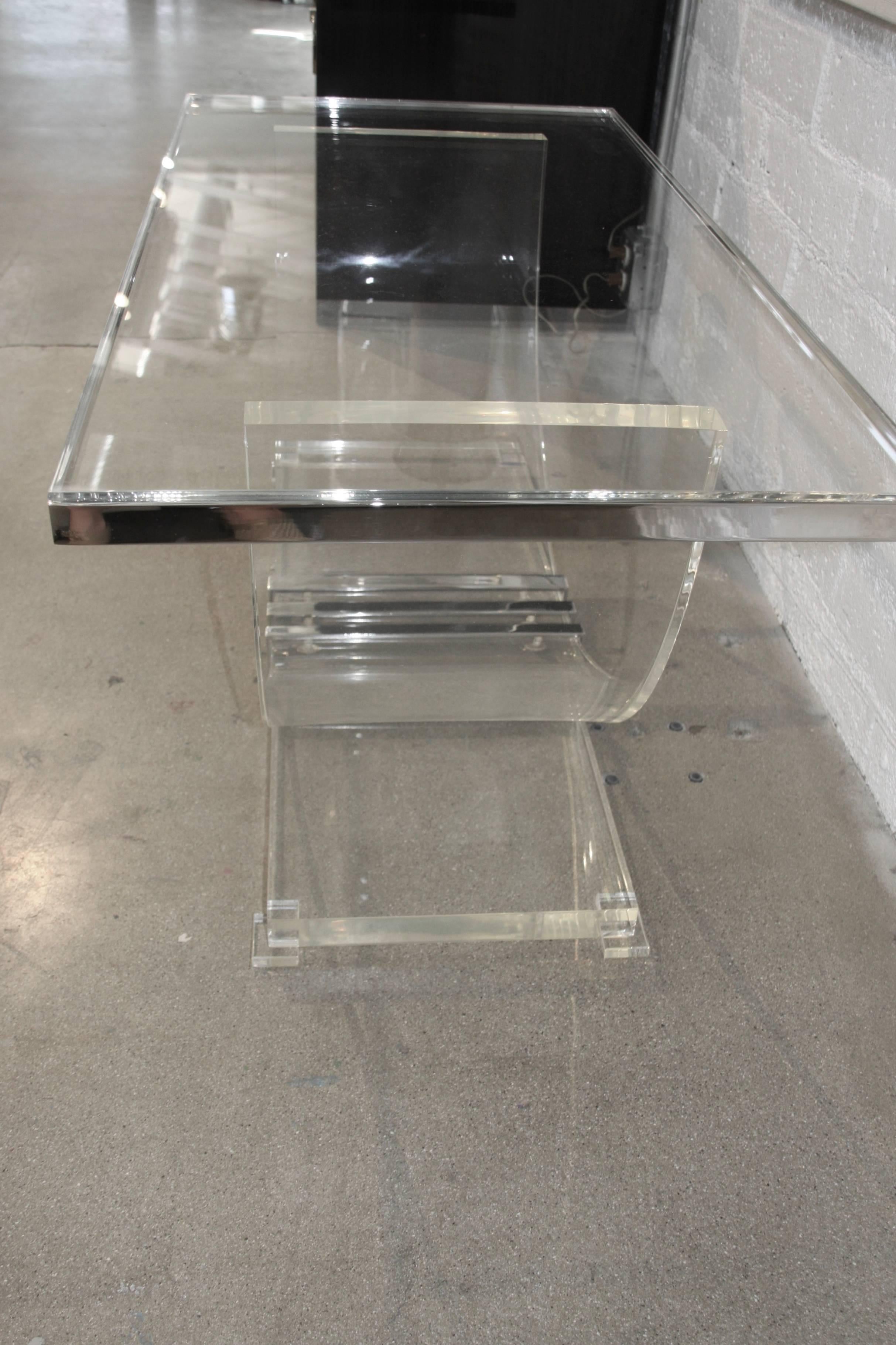 A very nice Lucite and metal banded top table, which dates to the 1970s. Some yellowing to the base, please see the detailed photos. The top is new and was made and signed by Charles Hollis Jones.