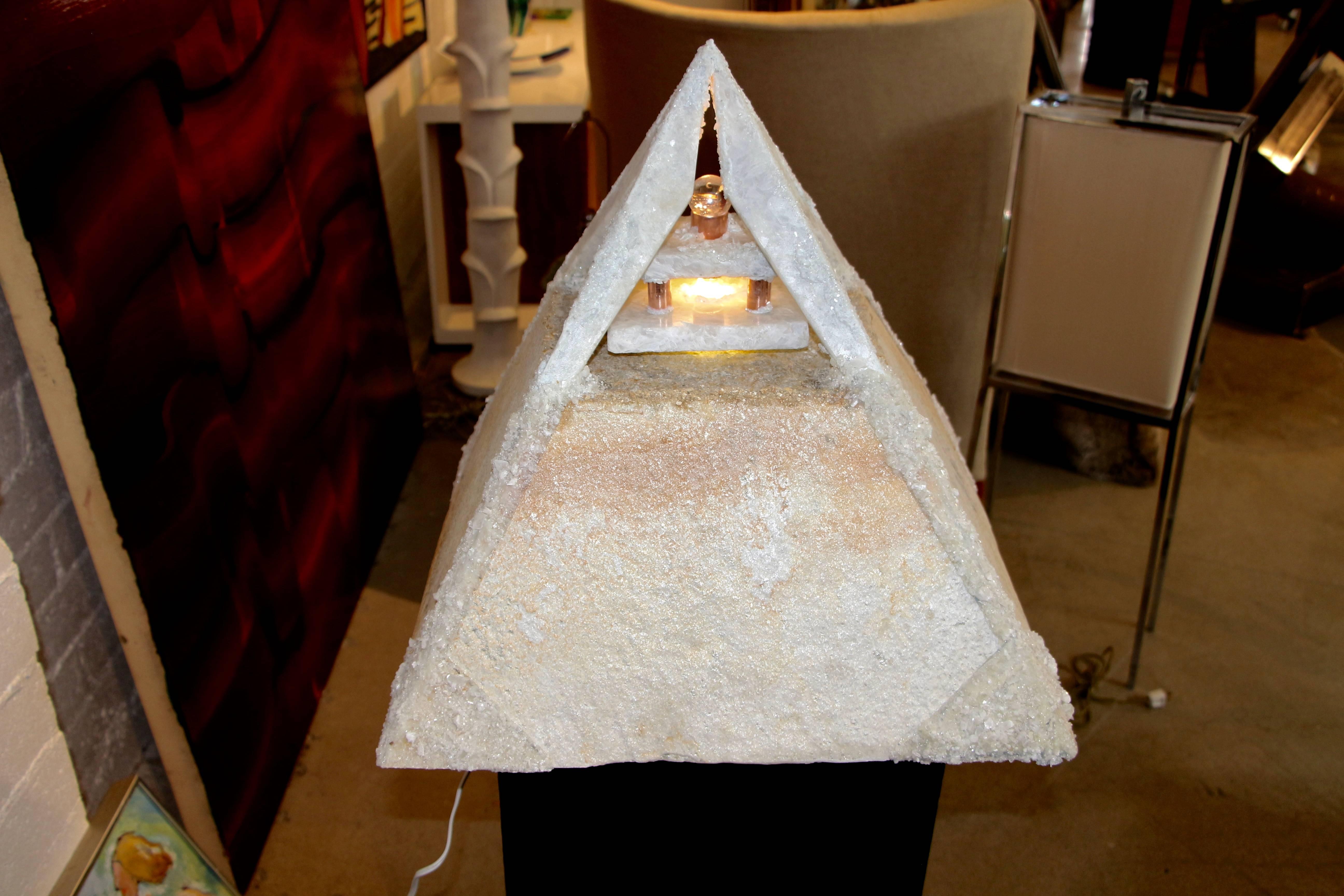 A wonderful pyramid shaped lamp made out of Quartzite and quartz crystals. It was made by a local Palm Springs artisan Carlos Gaona. Quite heavy. It is inscribed on the inside with the following words, Pure Love, Divine Guidance, Creations bound and