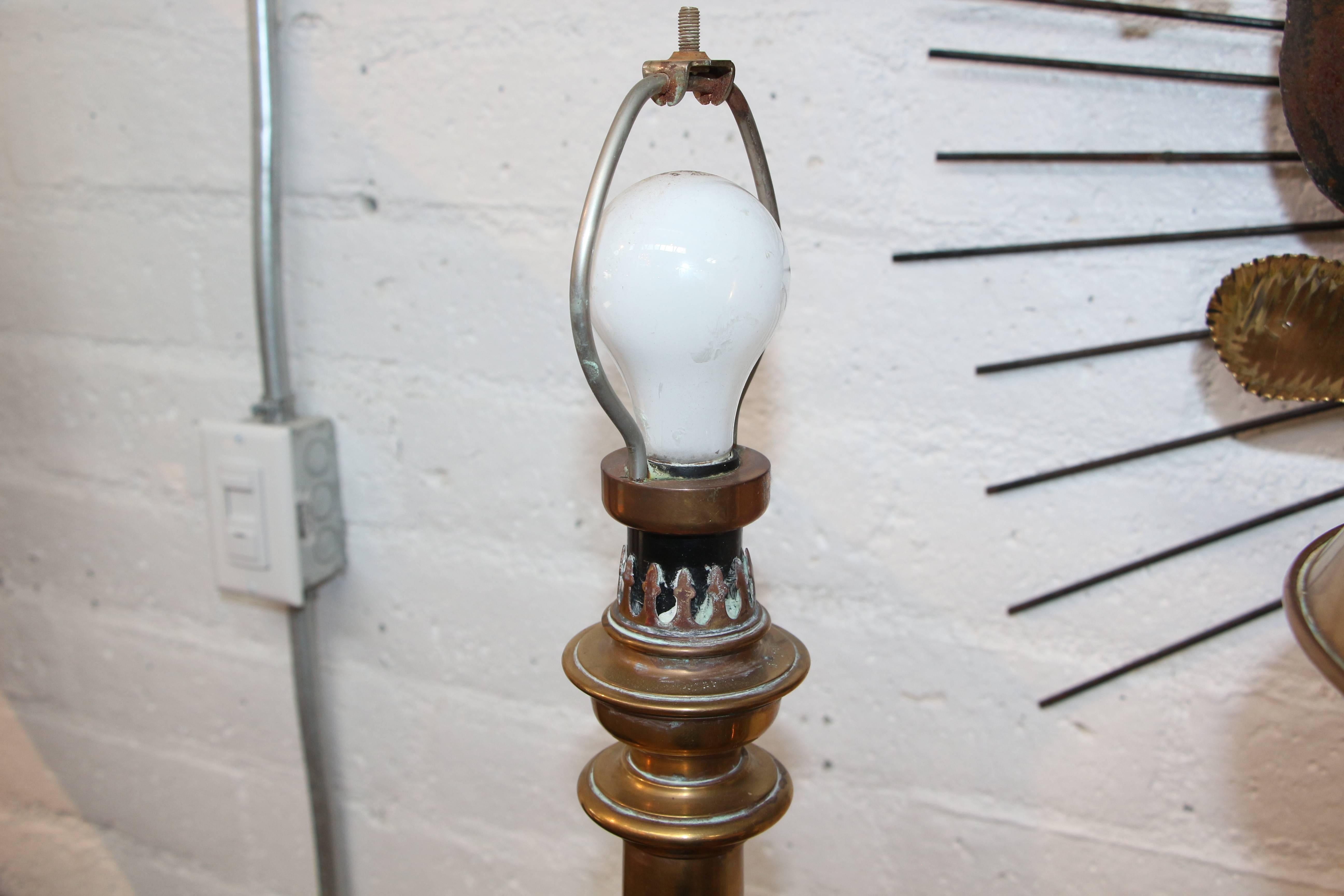 A pair of extremely well-made Chapman brass lamp with brass shades. These lamps are solid brass and quite heavy. They are extremely well-made. One has a label that reads Chapman 1983 stuck to a felt base. The other does not have any felt. There is