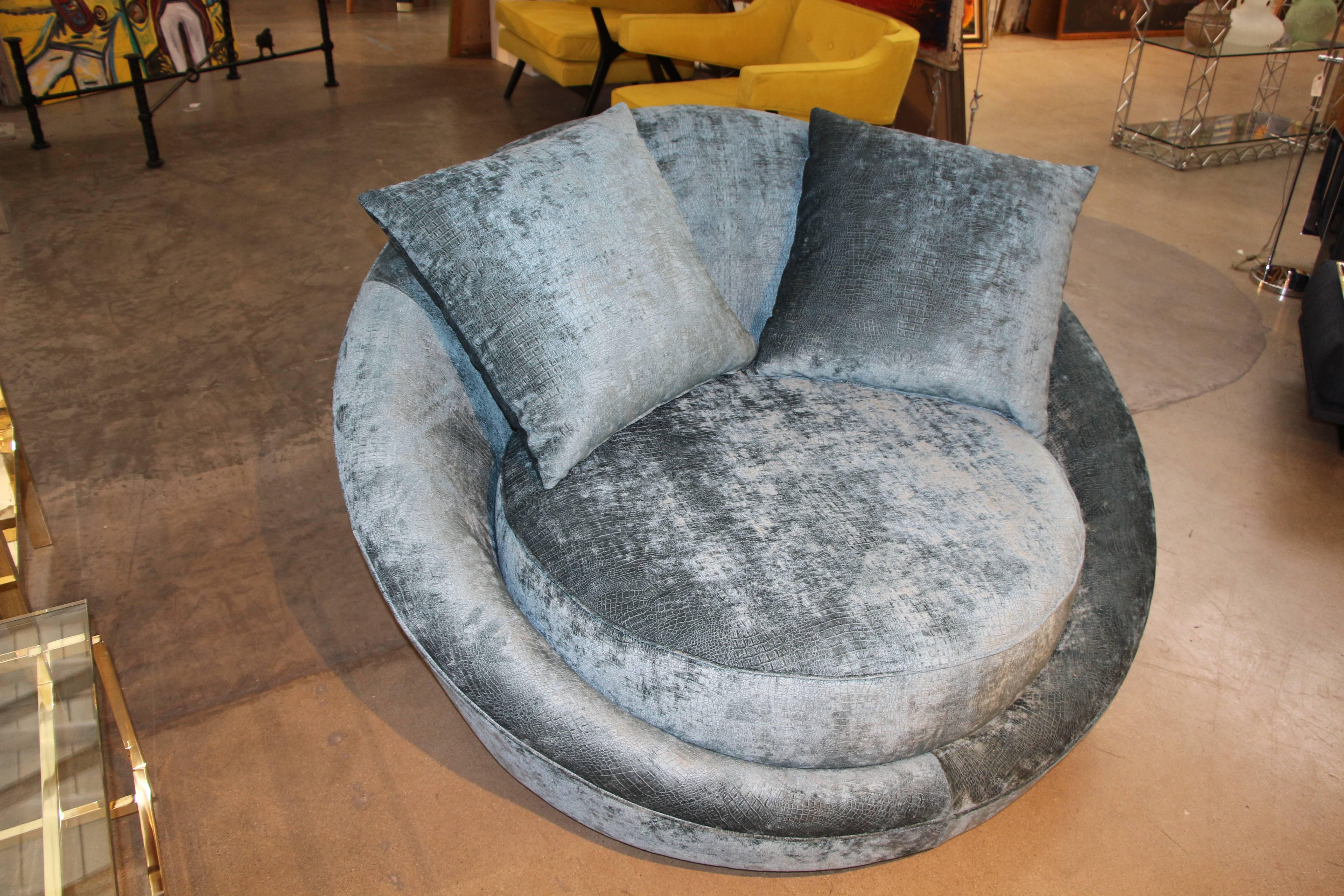 A nice comfortable Milo Baughman designed lounge chair i have heard referred to as the UFO chair. It has been re-upholstered in a patterned fabric, please see the photos below.