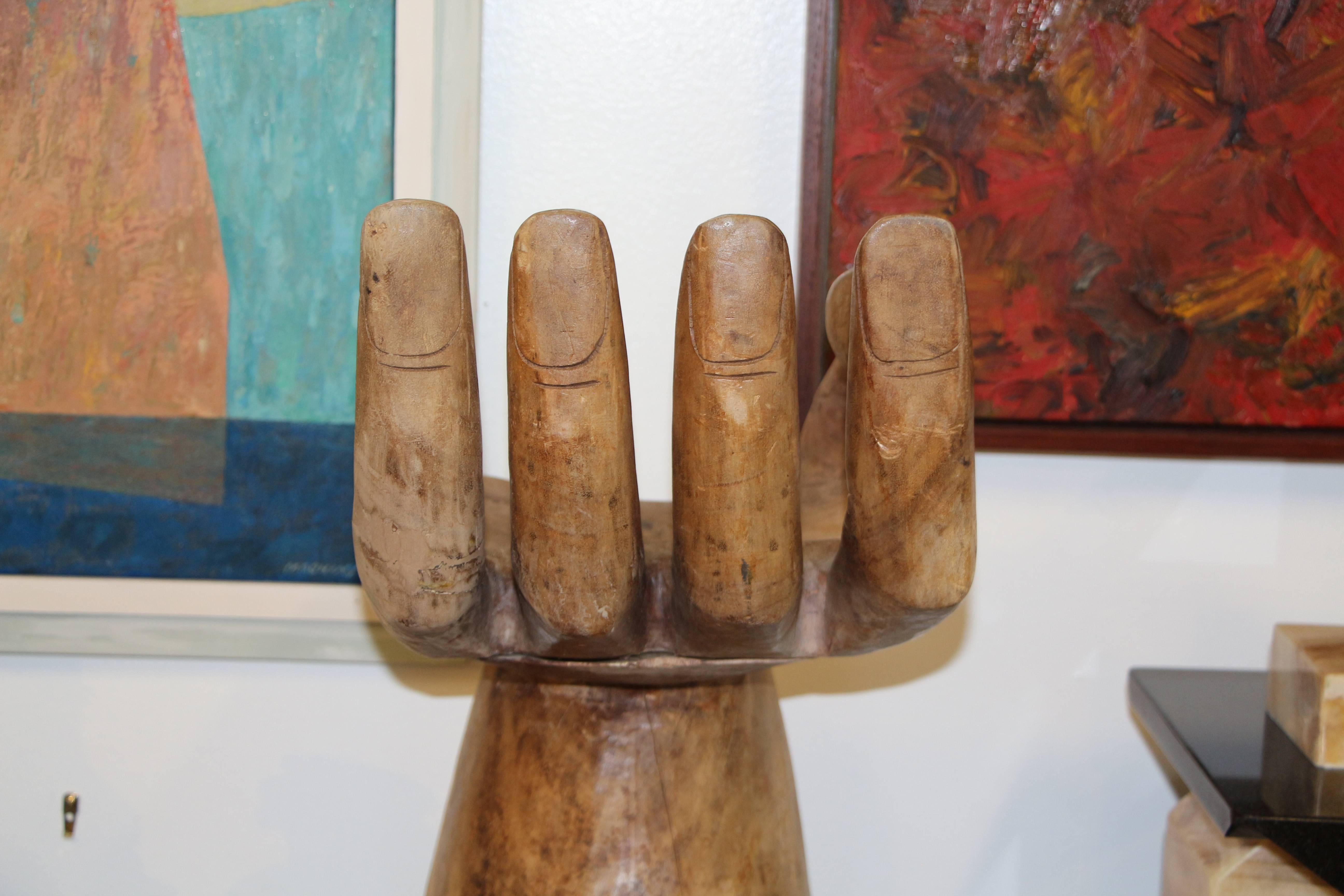 A nicely done sculpture in wood of a Pedro Fiedeberg hand chair. It appears to have some age as there is quite a bit of wear and repairs. There is cracking as well, please see the detailed photos. it is not signed. 
Please take a moment to have a