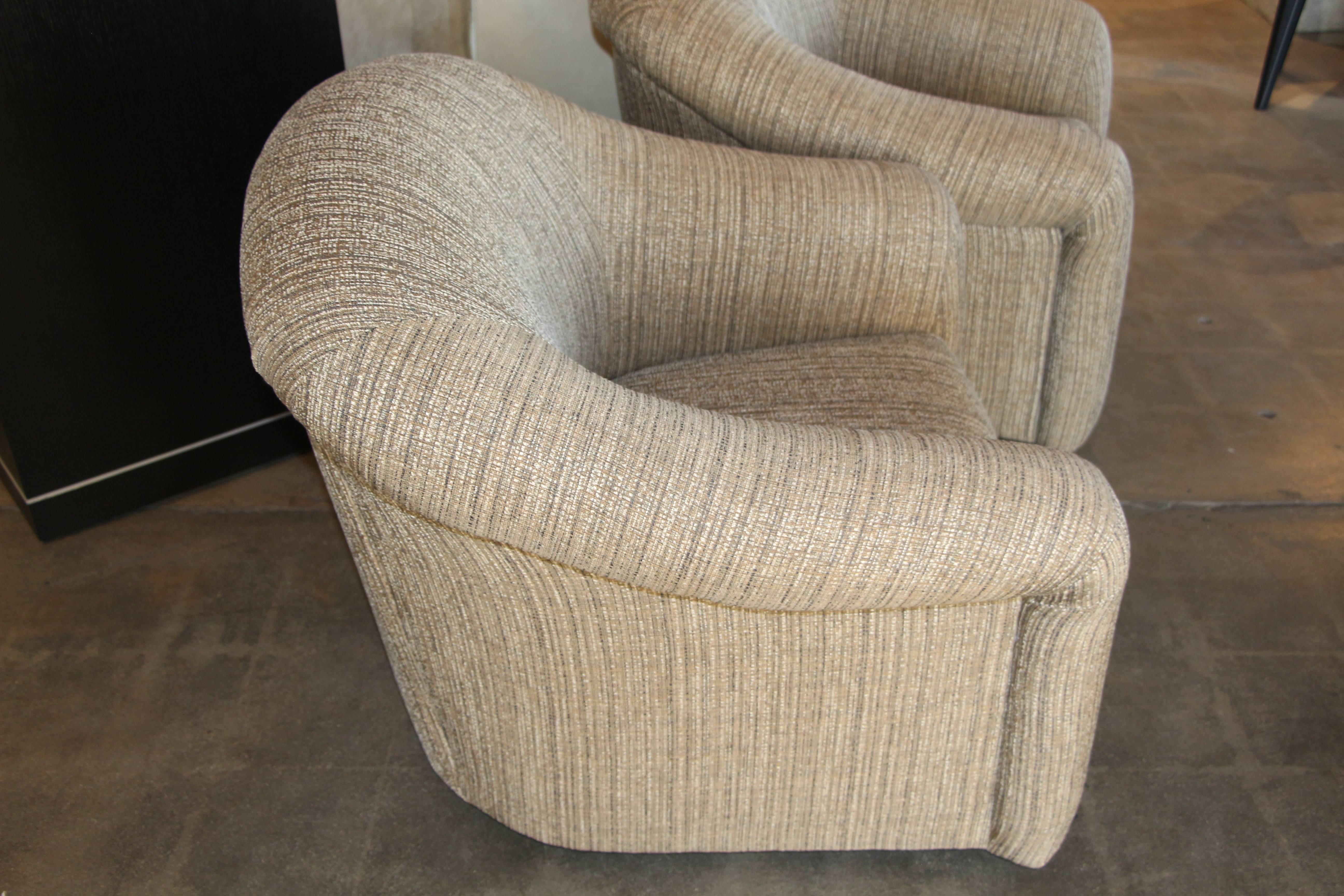 American Pair of Comfortable Swivel A. Rudin Chairs and matching ottomans