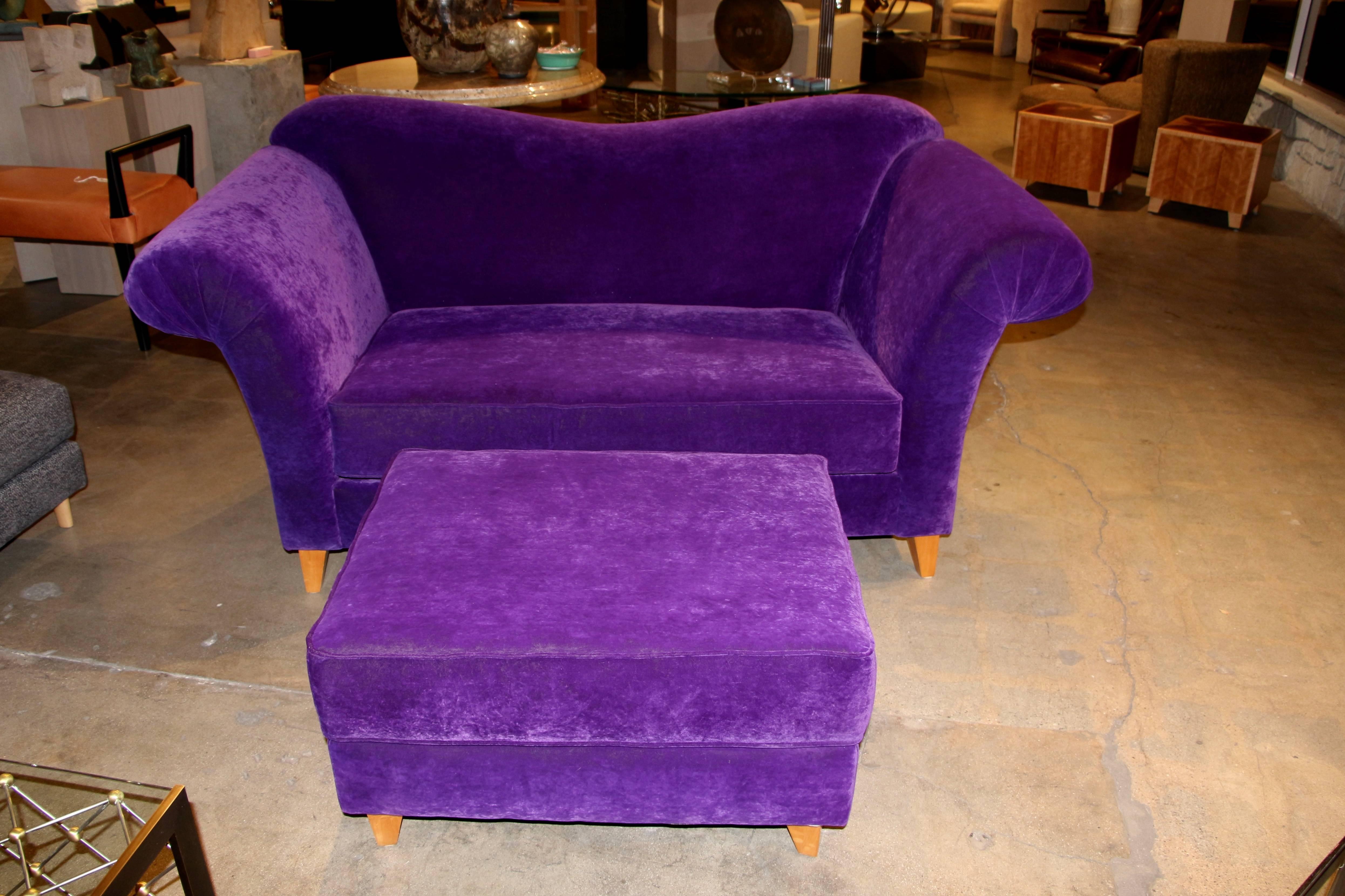 A nice purple Loveseat or settee with matching ottoman. Not sure what the fabric is made of but it feels like a mohair blend. Great vivid purple color, the legs rotate and need to be aligned, as they can’t at an angle. There are some losses and