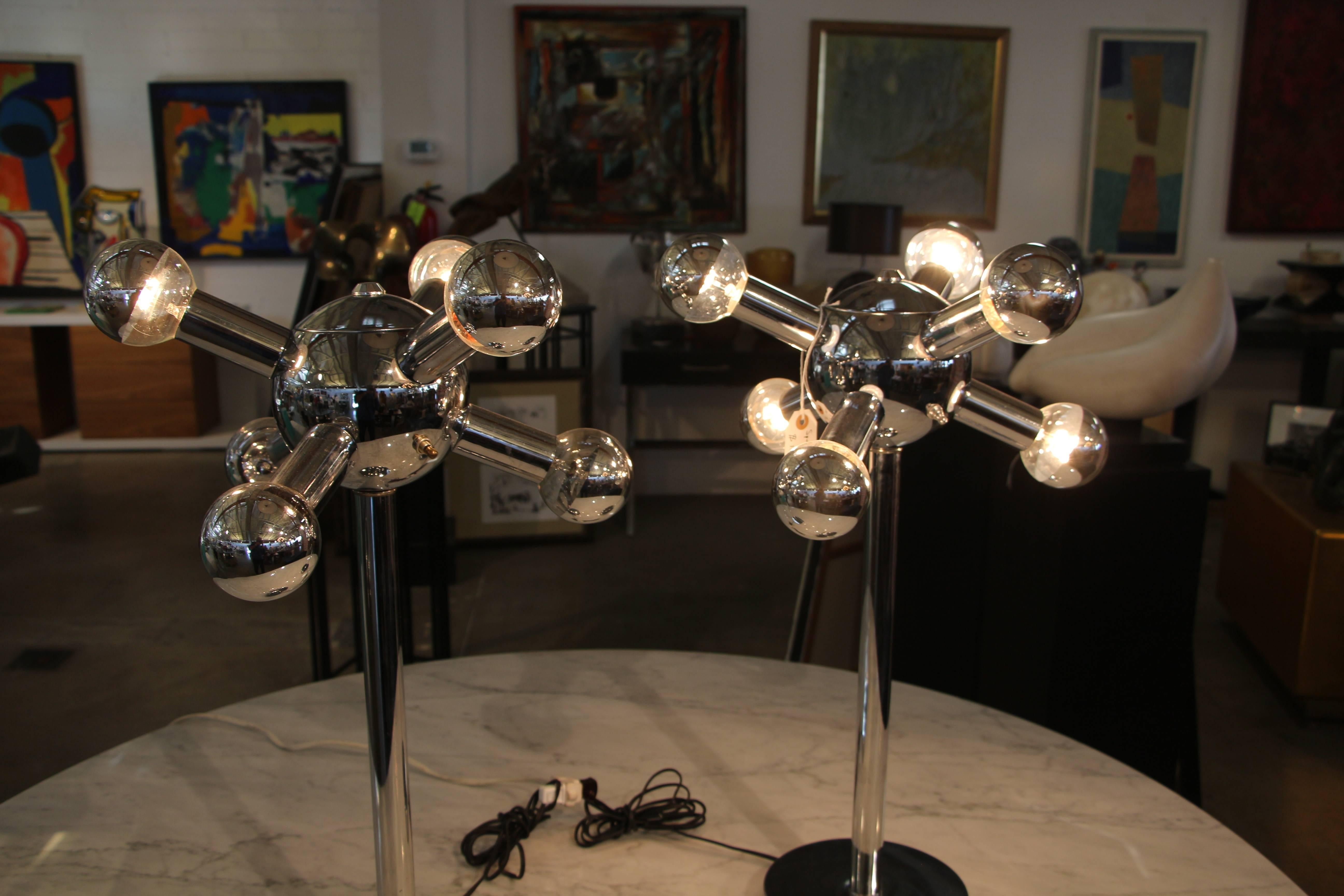 A nice pair of Sonneman Sputnik lamps in working order with three way switches. The lights can be alternated as pictured. Good age appropriate condition with some surface scratches and minor imperfections.