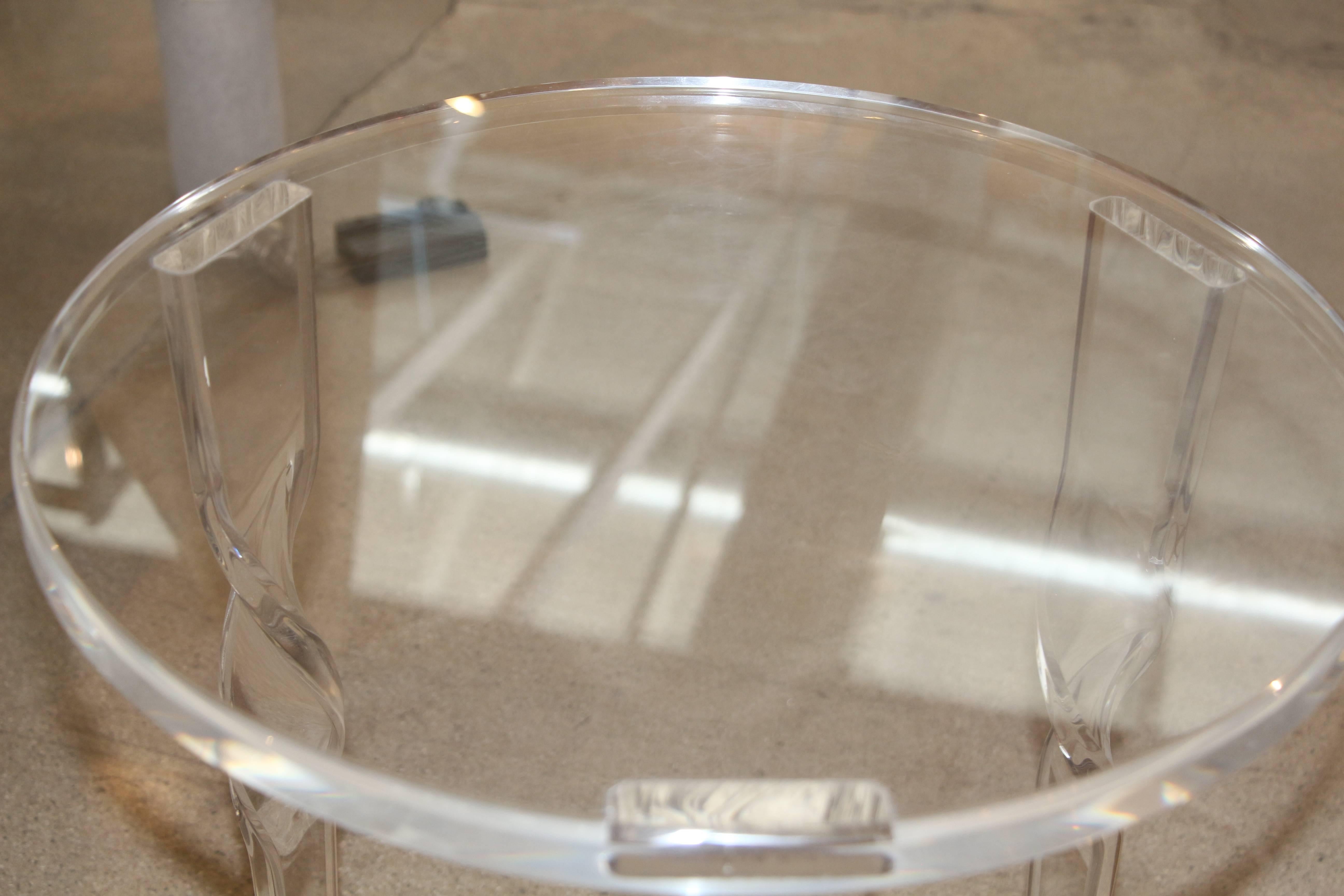 A nice Lucite occasional table in Lucite with a twist leg. The table is stable.
There are some surface scratches and minor marks overall in nice age appropriate used condition.