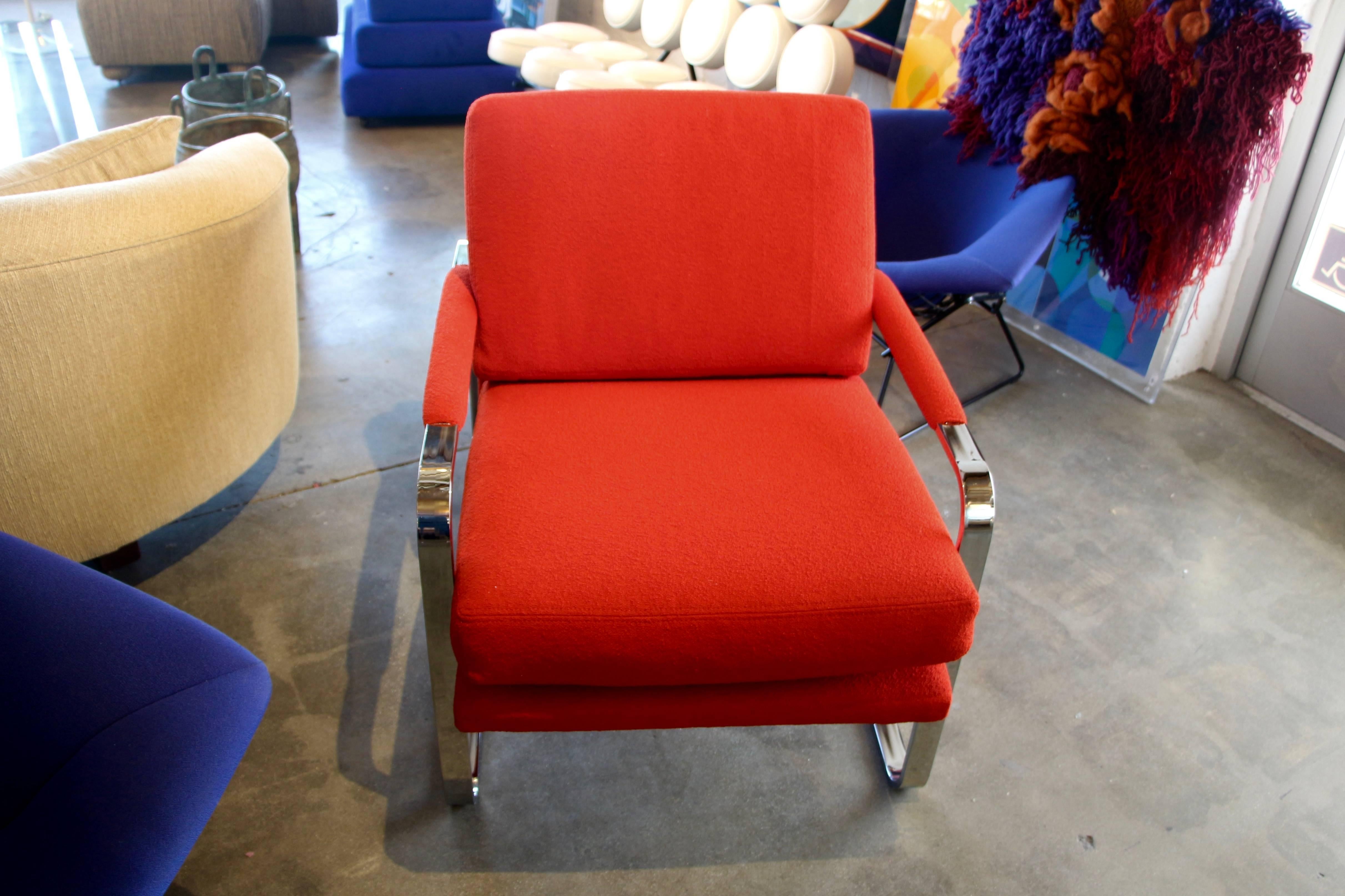 A beautiful chair in the style of Milo Baughman. This one has been redone in a nubby red Knoll fabric. Nice proportions and in good conditions with only minor marks and surface scratches to the chrome.