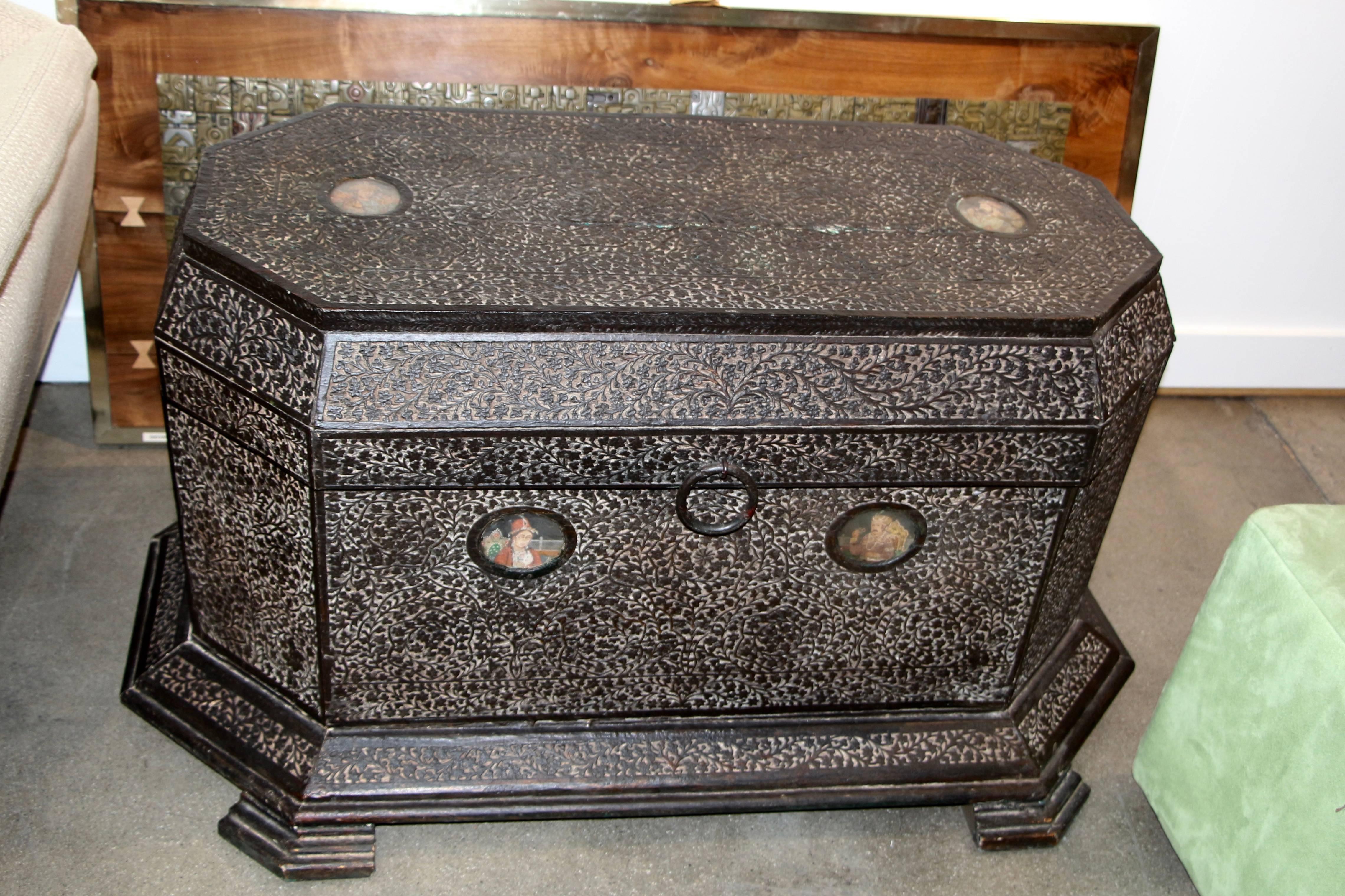 A beautiful pair of dowry or marriage chests that probably date to the Mughal period in India. They feature wonderful carving and portraits. I'm not sure what they are painted on. One of the glass covers is broken and the others are dirty. There are