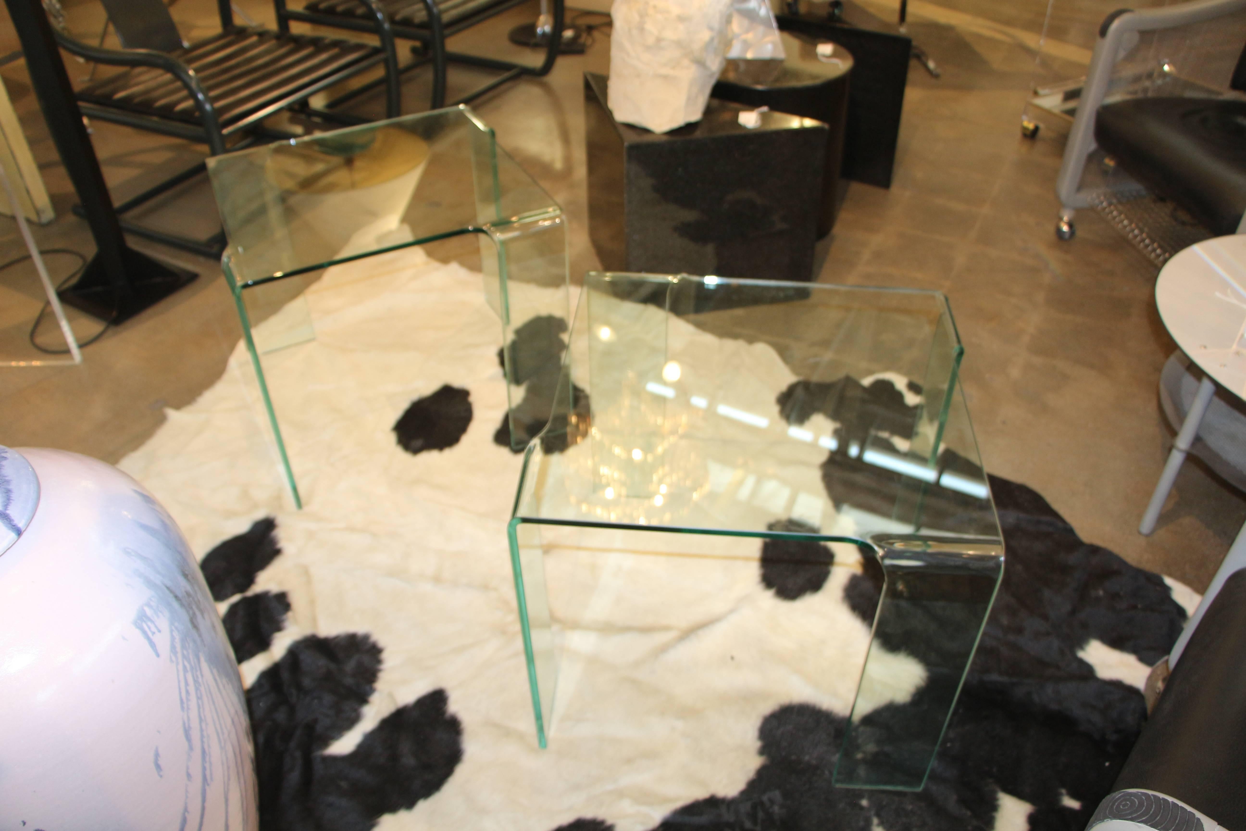 An elegant pair of Italian glass end tables attributable to Fiam likely from the 1980s. In good age appropriate condition, with no chips, but surface scratches and minor imperfections.