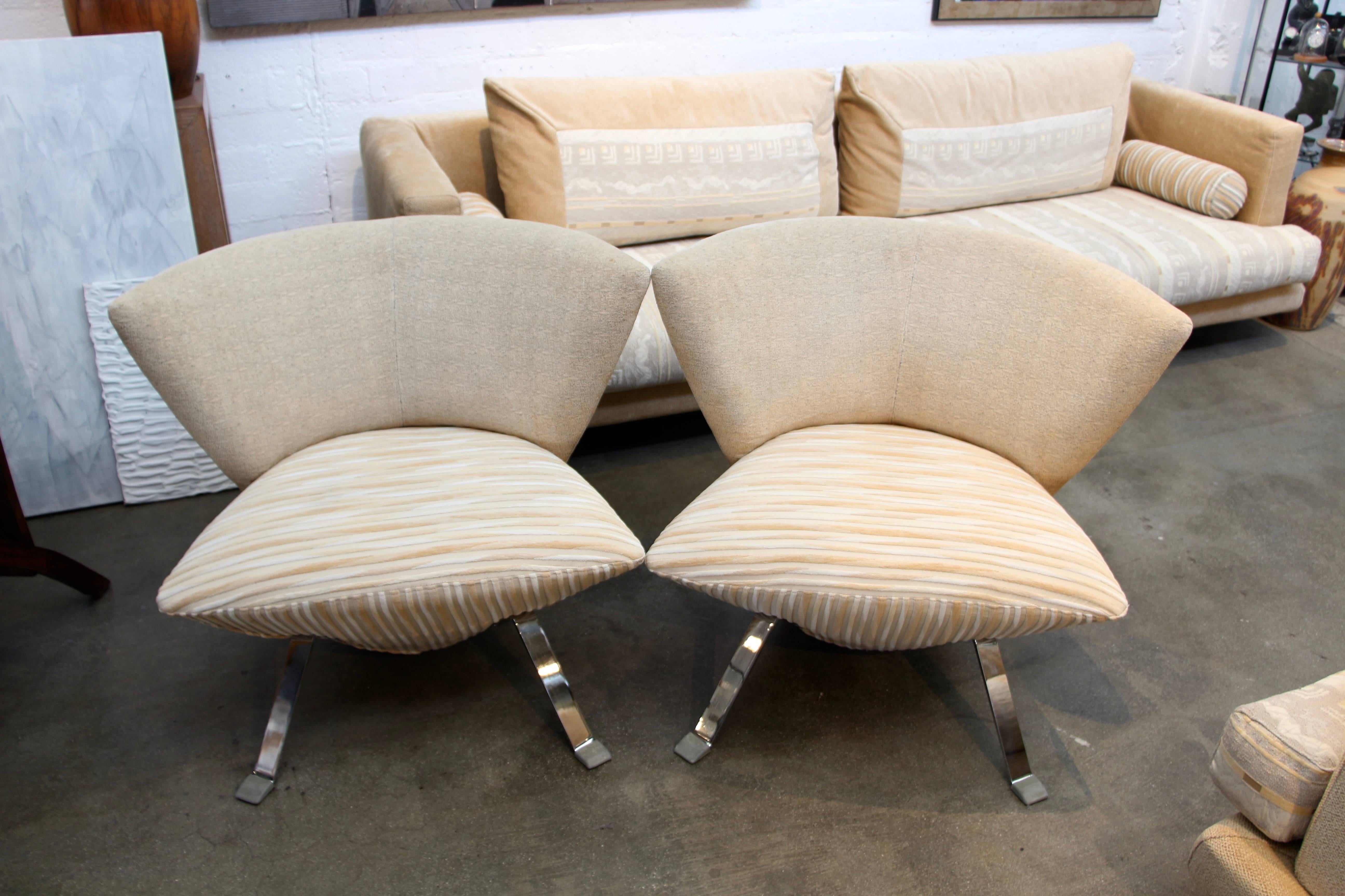 A pretty pair of chairs designed by Giorgio Saporiti for his firm IL Loft. They are quite comfortable in the original fabric from the factory. There are some minor imperfections and the fabric may have some imperfections that we missed. There is one