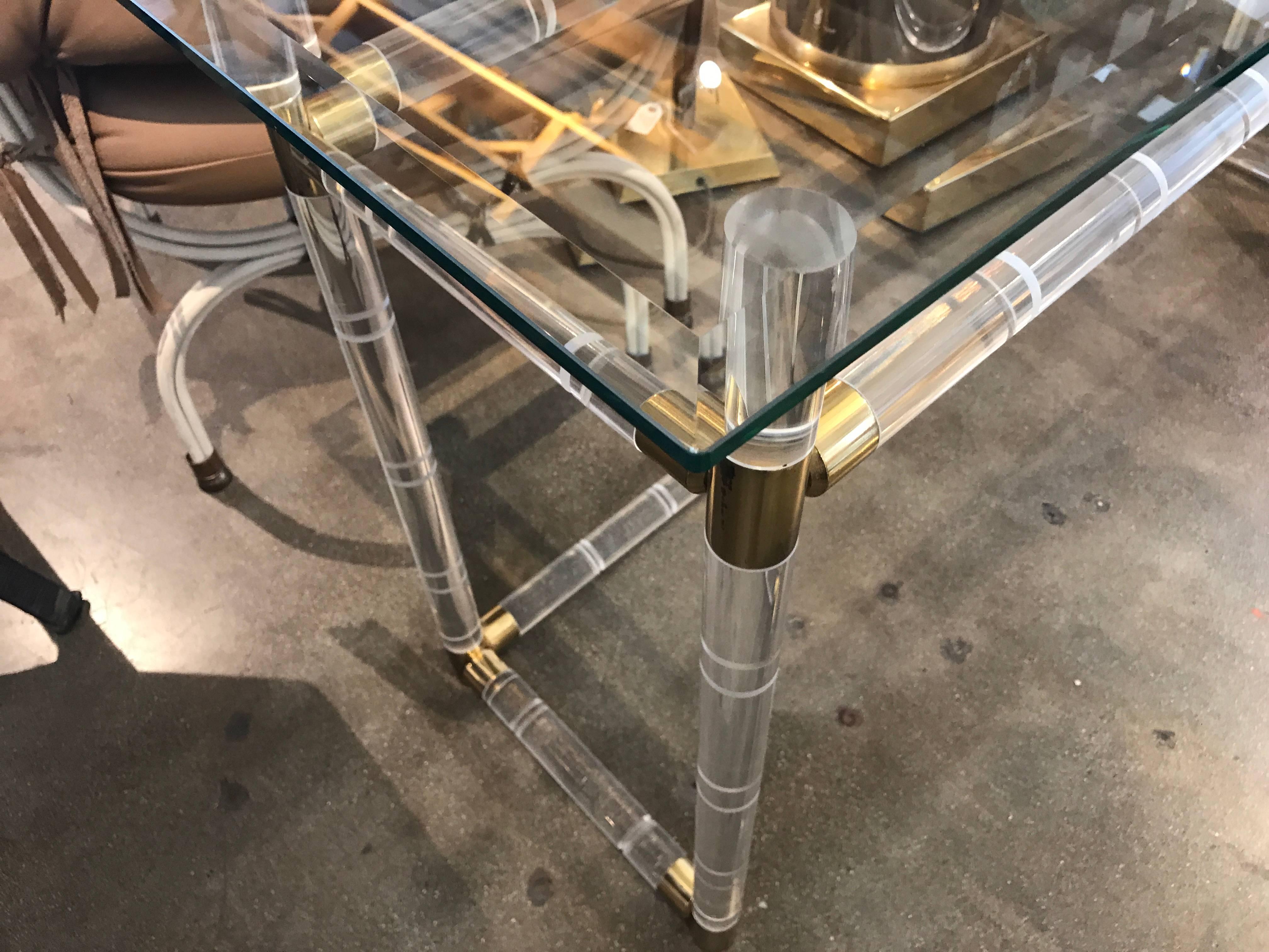 A nice early example of a Charles Hollis Jones designed faux bamboo Lucite and brass bar. I believe this dates to the 1970s. Not signed. The Lucite is in original age appropriate condition, with some scratches and nicks. Brass has also been left