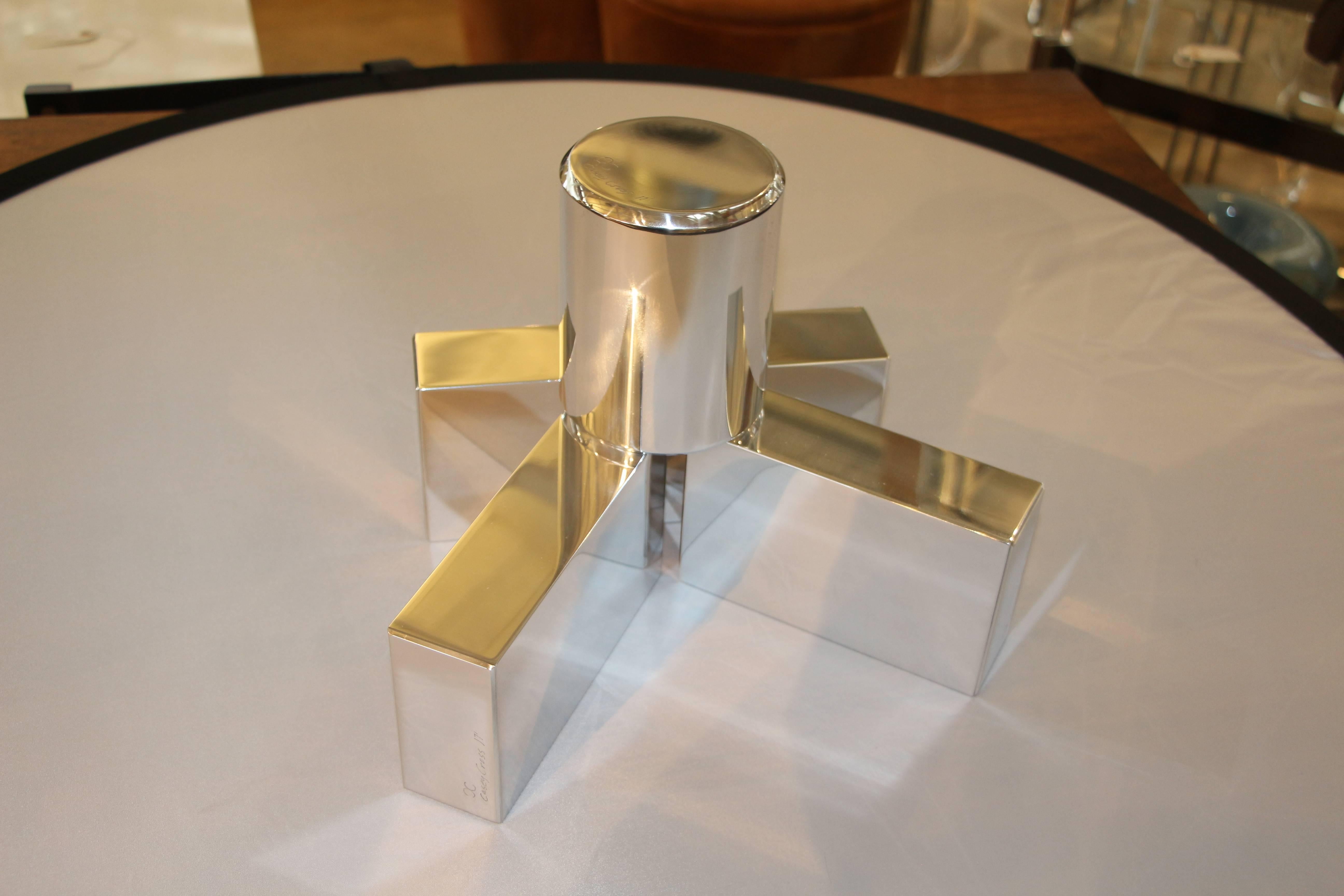 Our gallery is proud to represent an new talented artist Casey Cross who now resides in Palm Springs, CA. His work is unique and quite unusual. These geometric shapes can be arranged in any way. They are polished aluminum shapes. Each piece has been