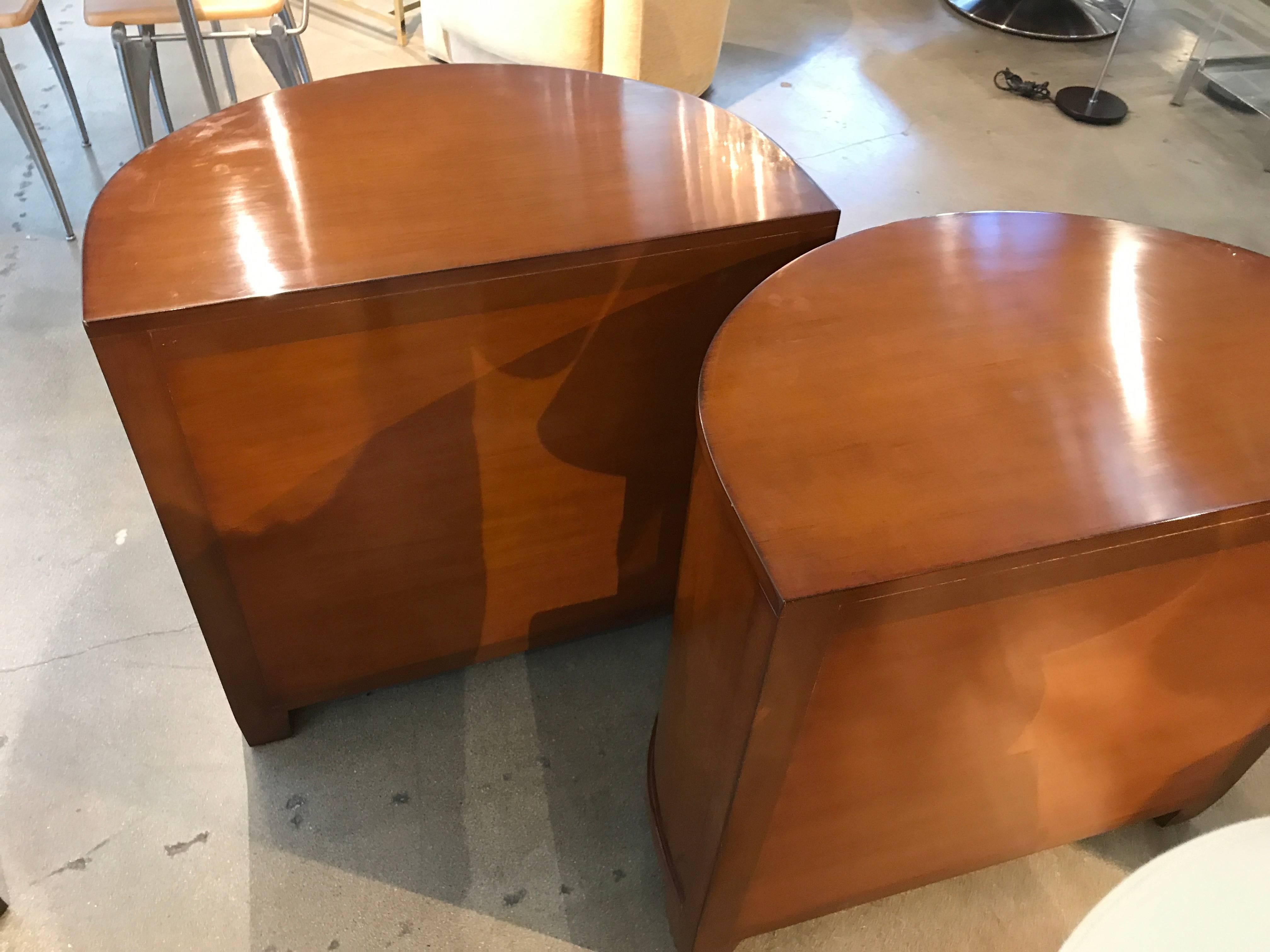 A nice pair of labelled Nancy Corzine demilune highly polished high quality end tables or nightstands. They feature interesting pulls. The drawers have the name marked on the inside. These tables are highly polished and were difficult to photograph.