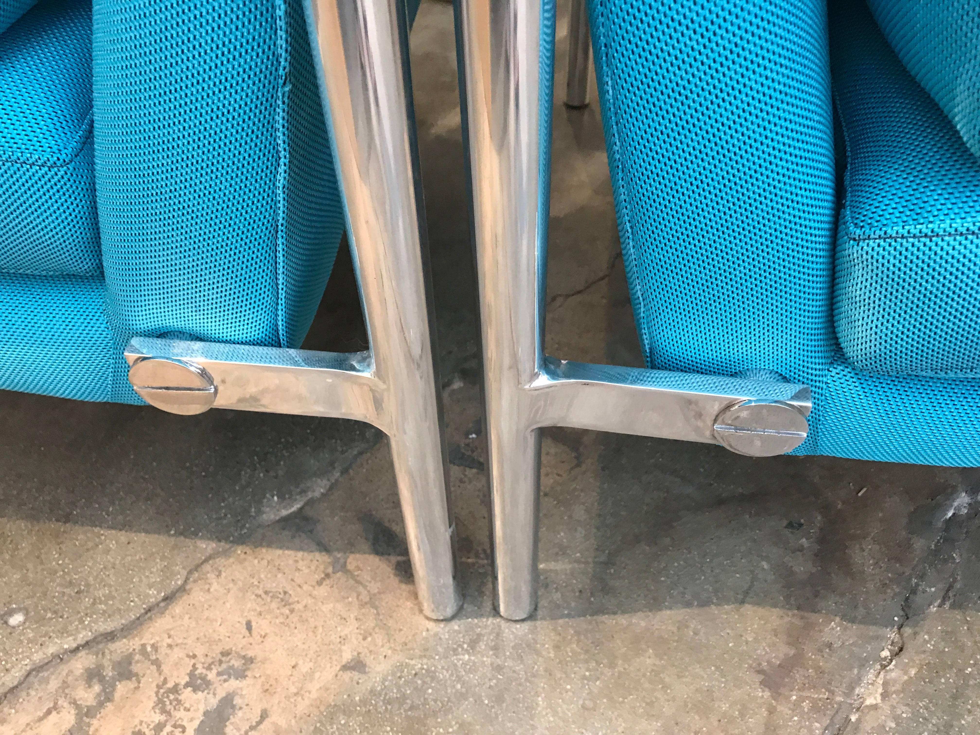 Polished aluminium frame lounge chairs, in the manner of Harvey Probber, newly re-upholstered with Turquoise Knoll fabric. A wonderful detailed touch is the exposed oversized flat head screws that support the combination seat and back