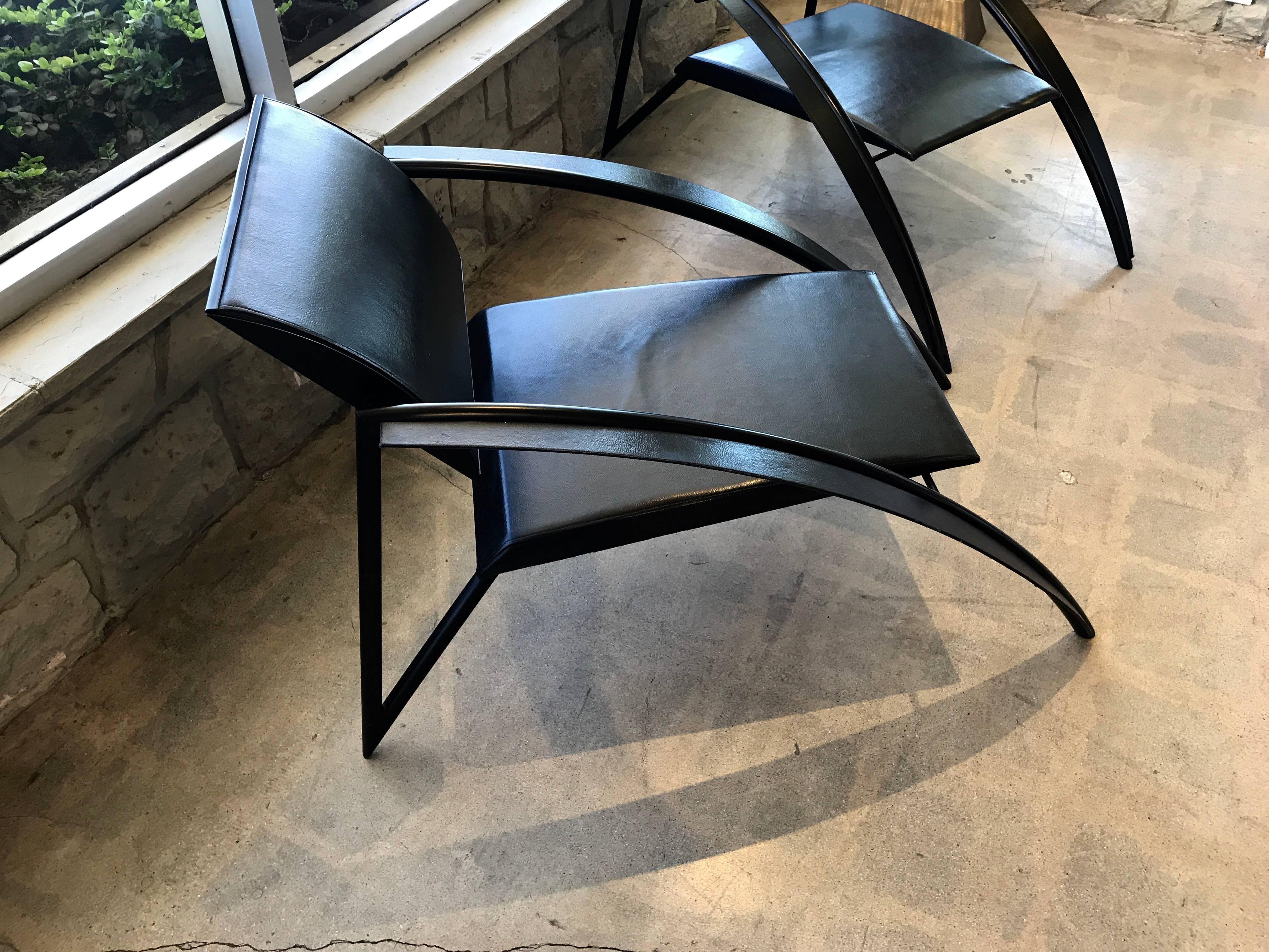 This is a pair of rare stunning vintage armchair designed by the French Architect Jean Louis Godivier. They were created in 1980s and a version of this chair was exhibited in a modern furniture expo at the Pompidou centre in 1986. A handsome