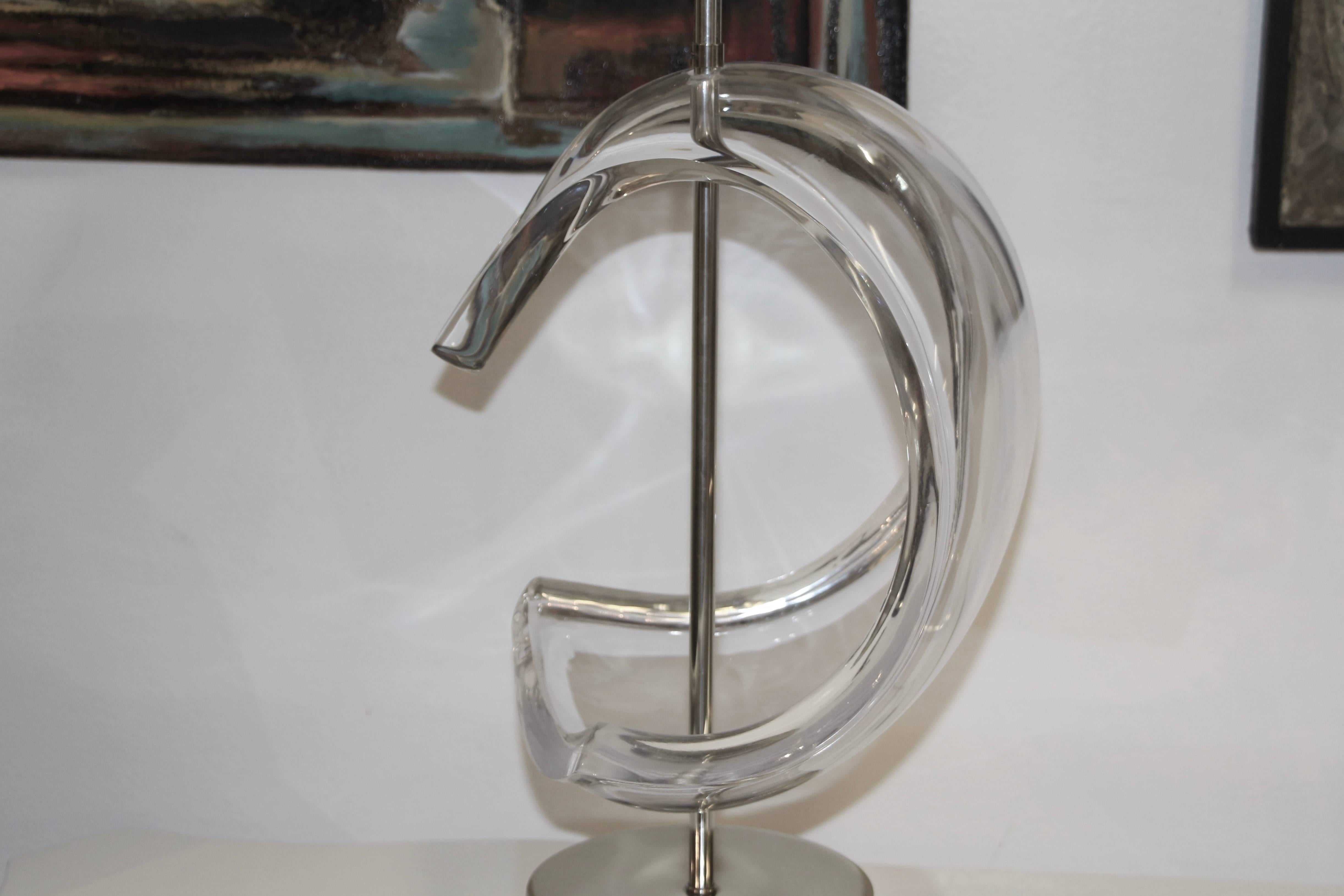 A nice Astrolite Ritts co Lucite lamp from the 1970s. On a cast metal base. It is in working condition, although the shade should be replaced. Some minor marks to the Lucite and metal.