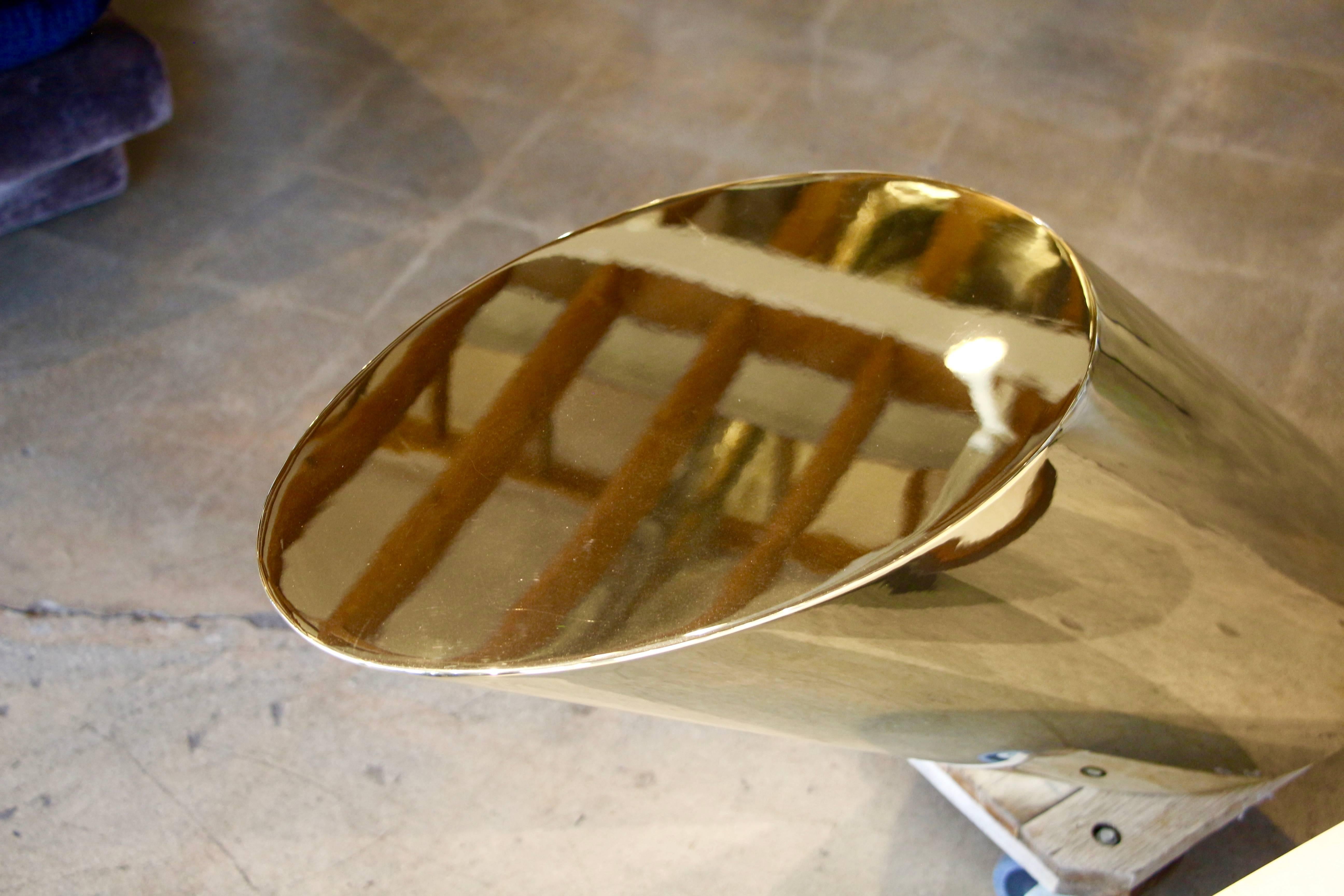 A nice vintage Zephyr table by Brueton from the 1970s in solid brass. This table has not been made in solid brass for quite a while, as they now make it in stainless and a coated brass finish. We have had it polished but it still has one small