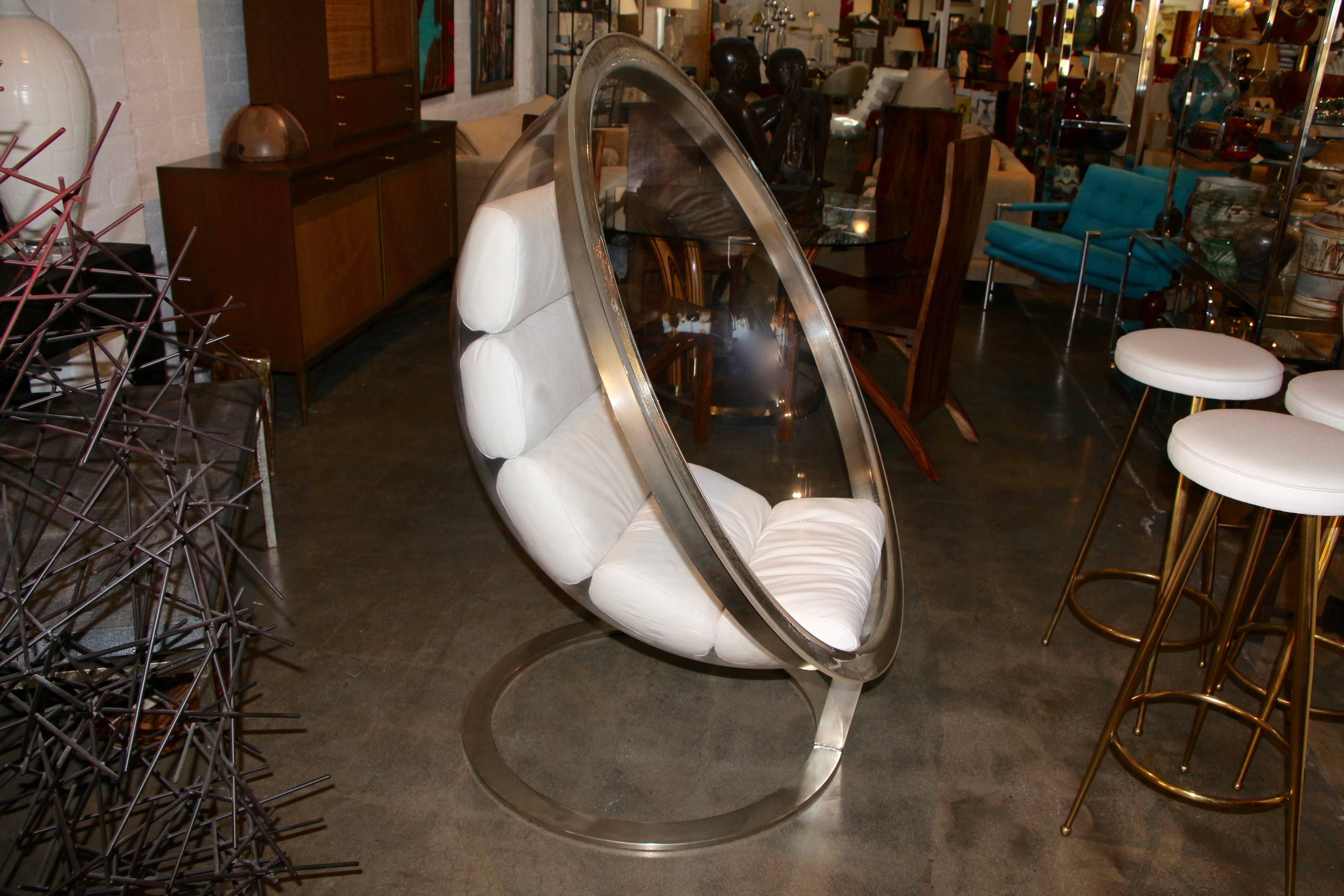 A wonderful bubble chair designed by Christian Daninos, circa 1968 and first made by Lacloche and later Formes Nouvelles. We had a comfortable leather cushion made with some aluminum strip on the inside to form fit the cushions. I believe there is a