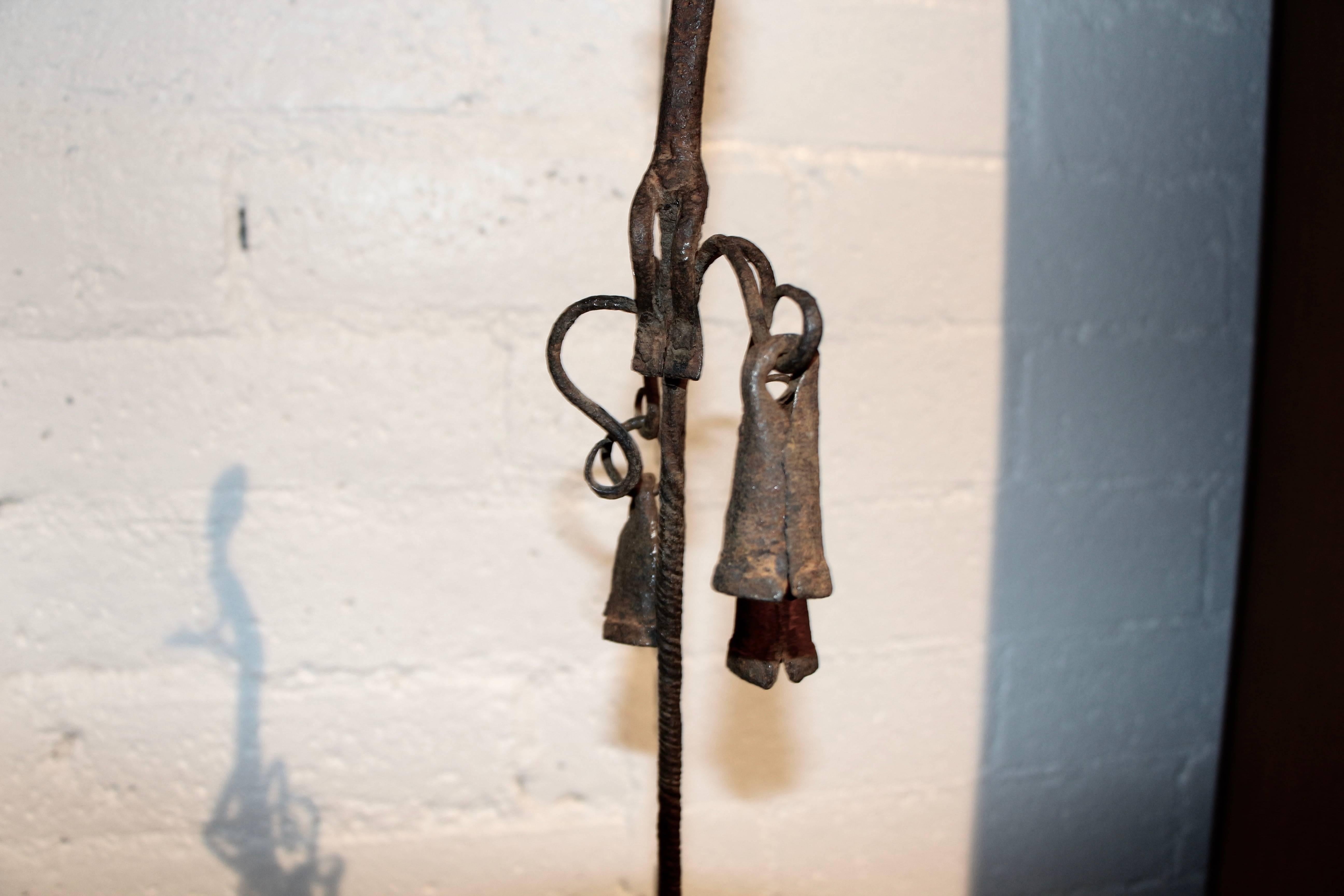 A nice early Bamana figurative metal staff from Mali, with three bells. I assume one is missing as the handle is there but the fourth bell is missing. It is mounted on a wood base and fits into a hole. Nice detail. These three pieces we have posted