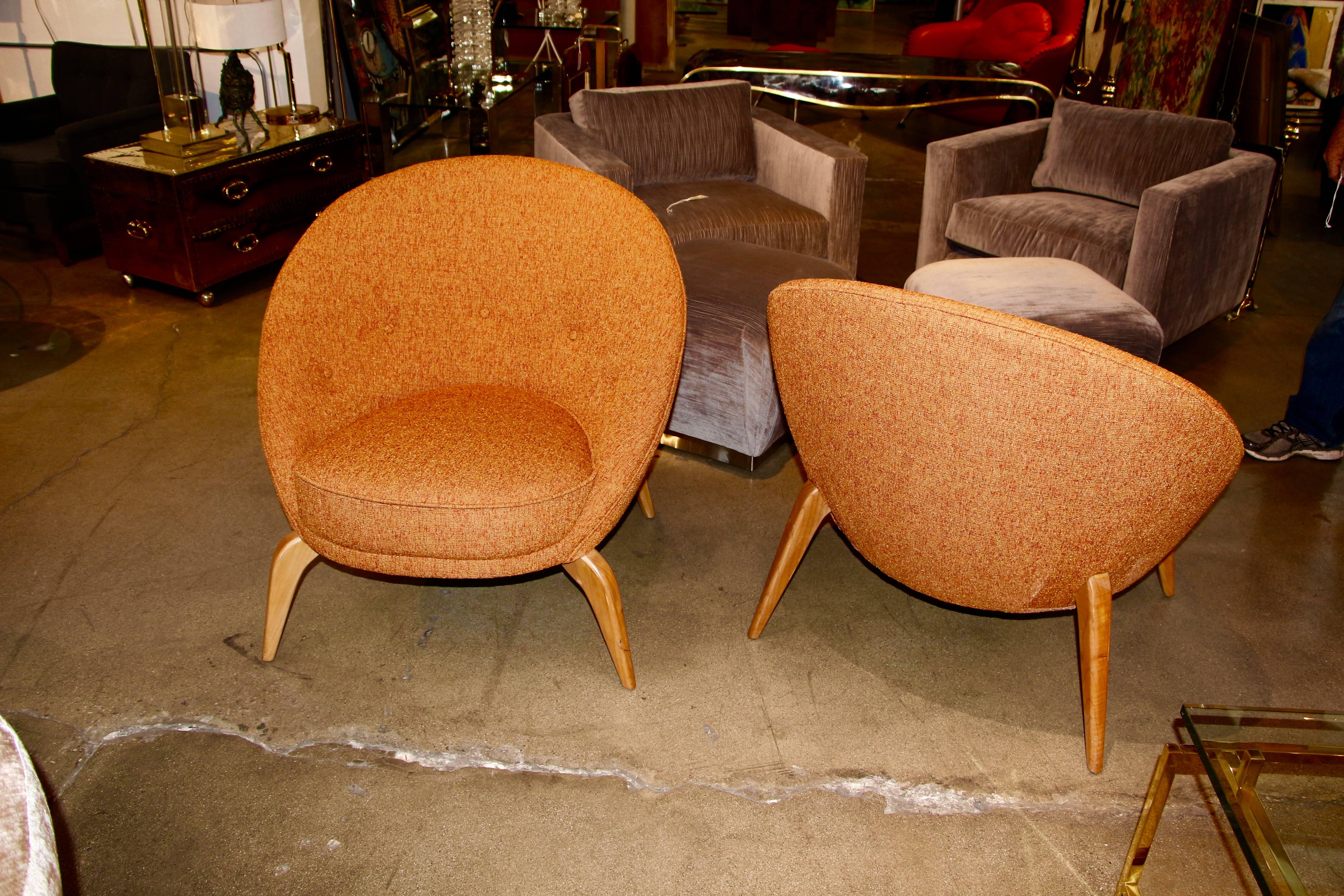 In the style of Jean Royère is this pair elegant mid century spider chairs. Extremely comfortable and quite sculptural, these chairs have been re-done and re-upholstered.