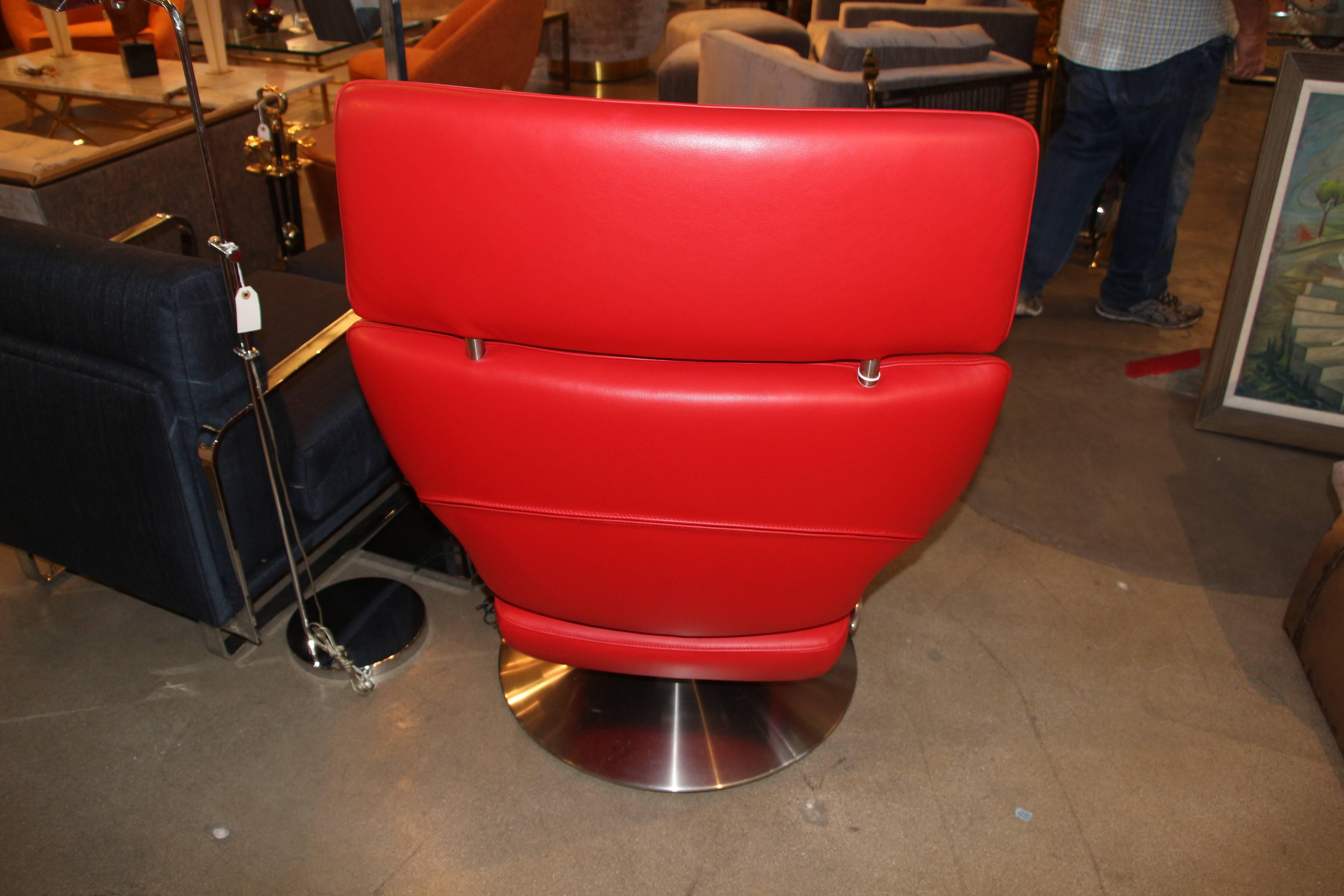 A beautiful red leather recliner with a blue oval Desede tag. Believe it is model DS-255. De Sede is an iconic Swiss firm which makes the highest quality leather furniture.
