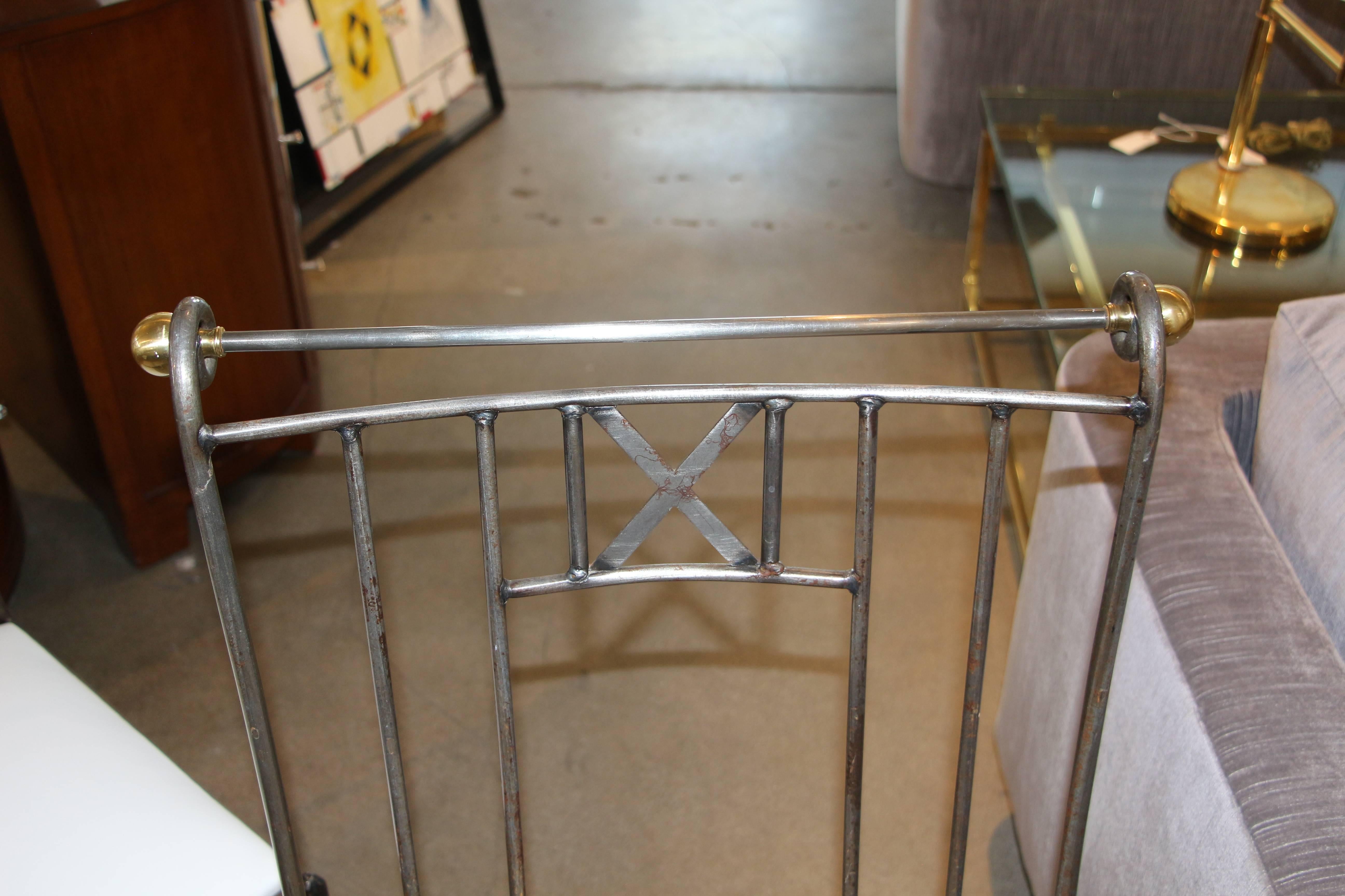 A nice set of four iron and brass dining chairs with new leather upholstery. They have a gloss lacquer finish. There is some rust in areas, which is pictured. These chairs are nice quality and the brass balls unscrew.