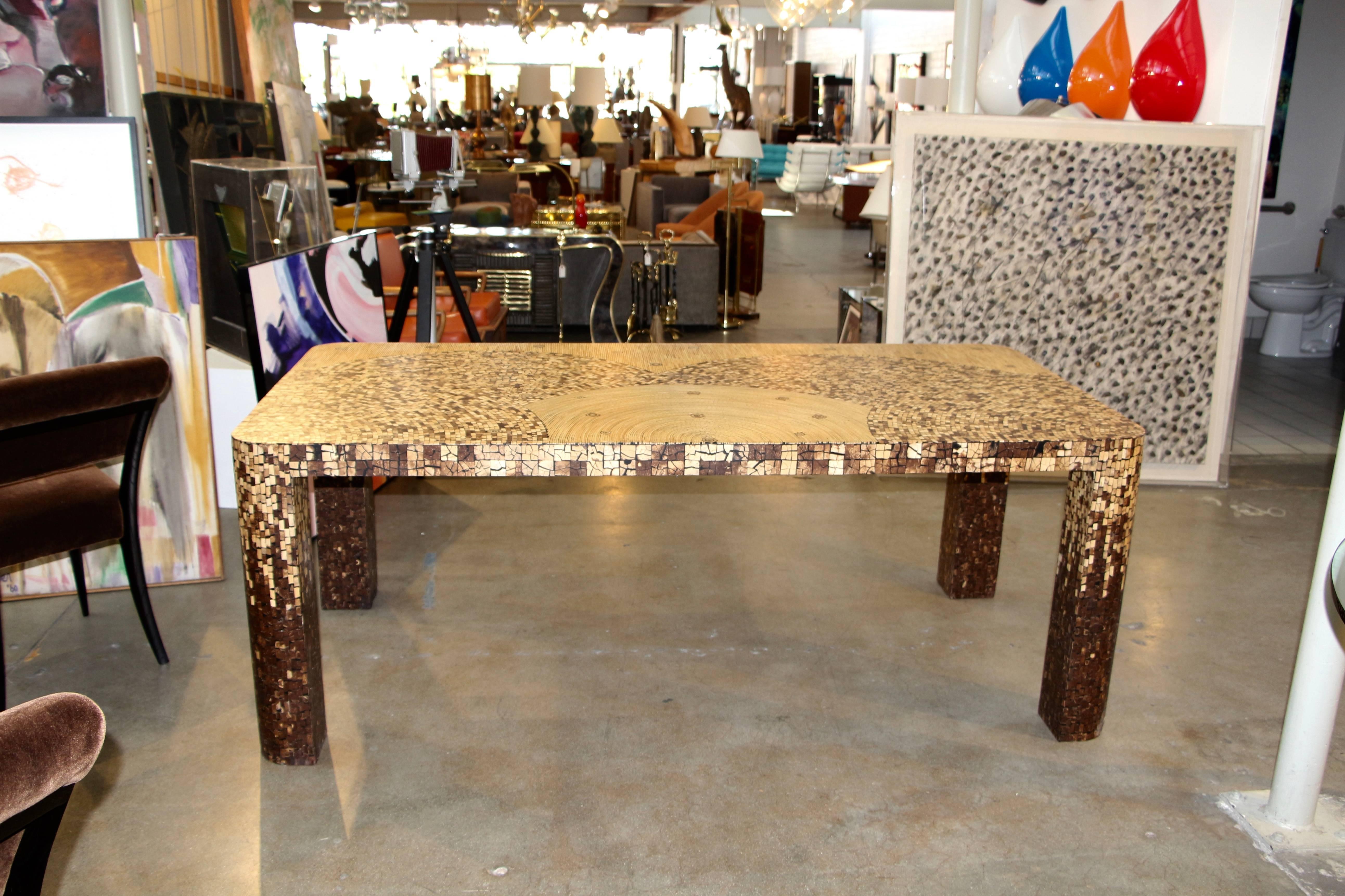 A truly unique and wonderful table made from inlaid bamboo and possibly coconut shell fragments. It is a stunning table. There are numerous little pieces that have been restored and retouched. This table makes quite a statement.