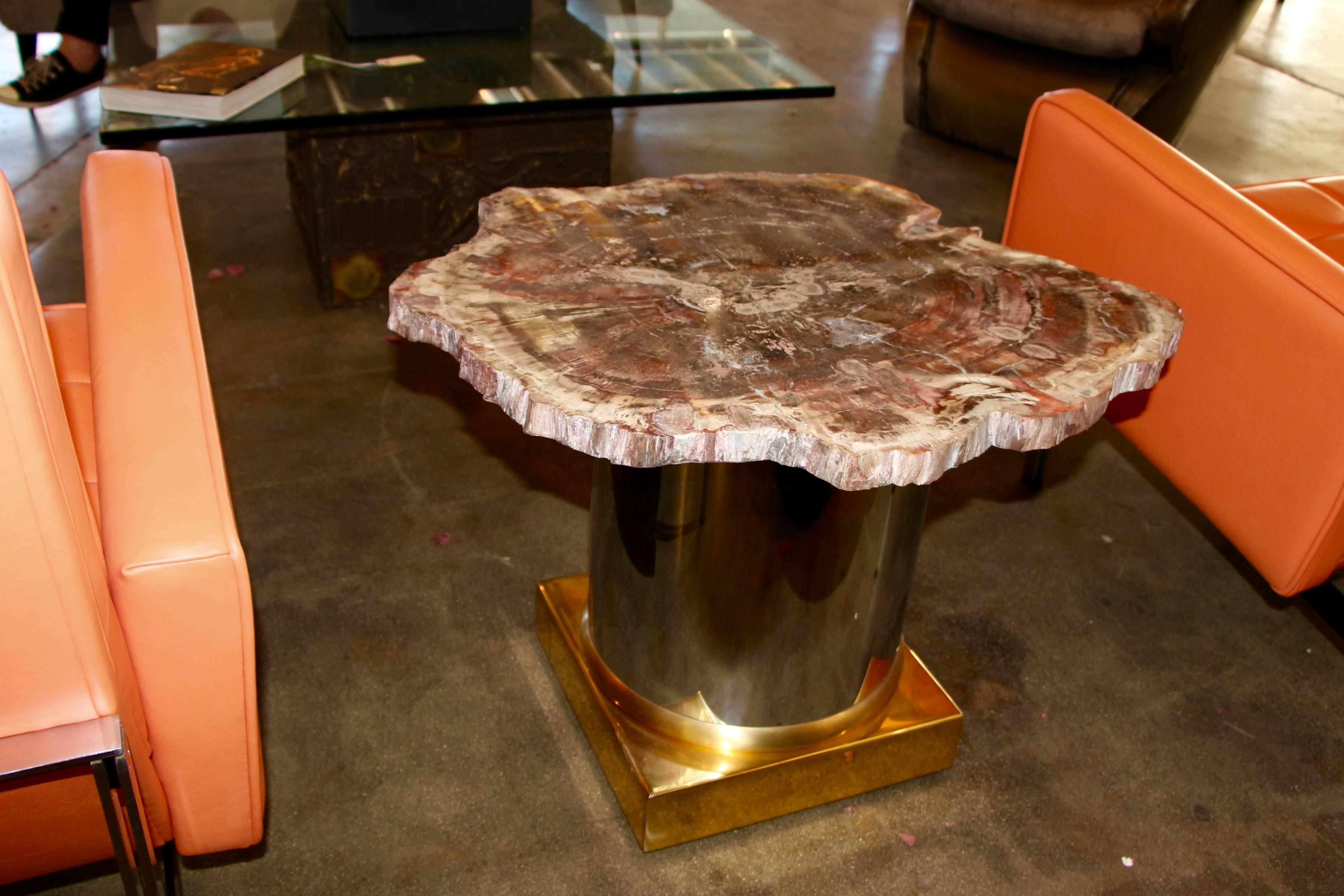 We found matched a 1980s base with a spectacular Arizona Petried wood top with a brass and steel base. It is important to note that this is real Arizona petrified wood not the imported Asian variety which is a very different kind of petrified wood.
