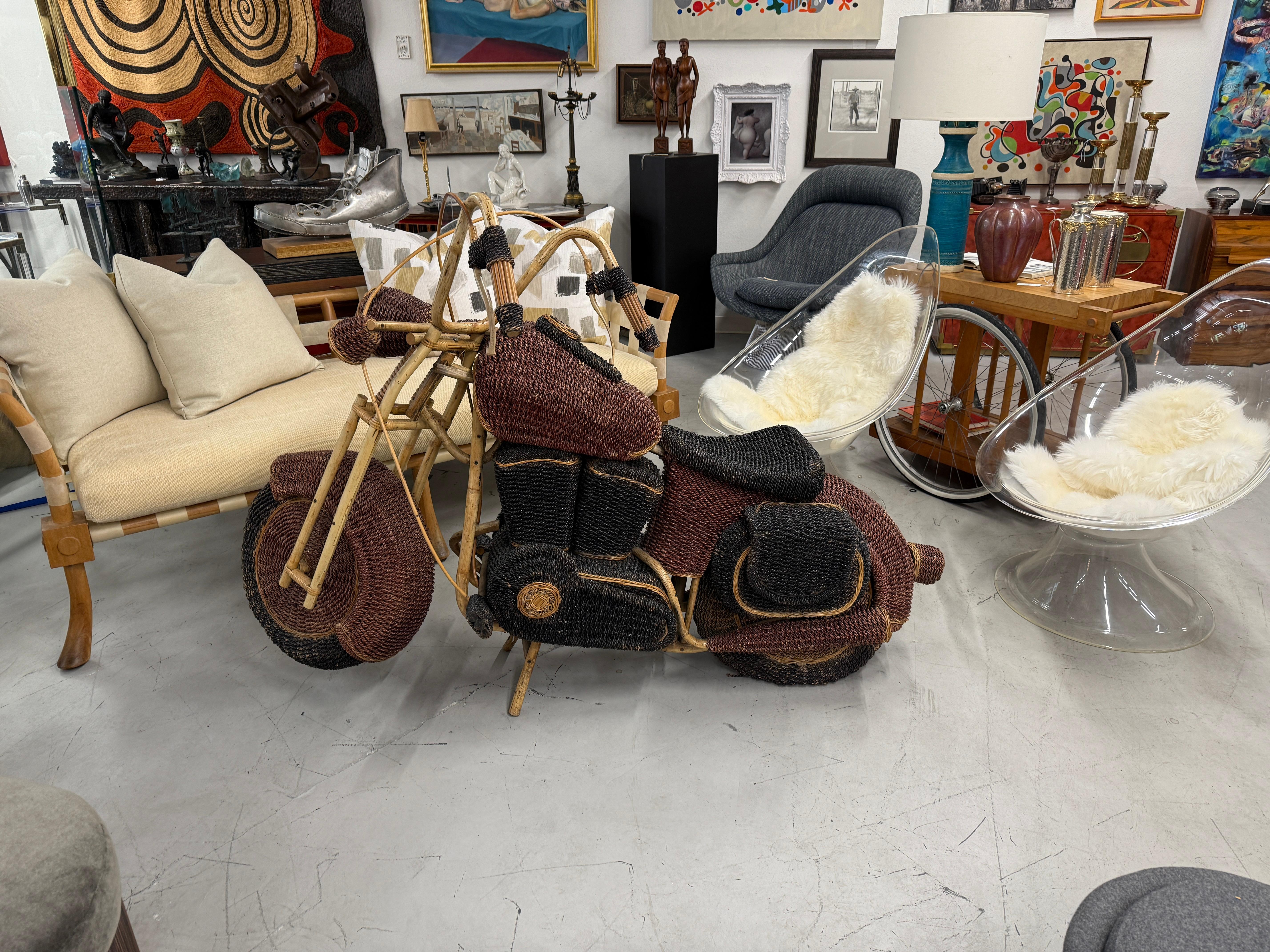 Very cool wicker and rattan motorcycle by Tom Dixon for a window display for Habitat in the UK from the 1980’s. This is an unusual example of this piece as this one was painted, most are natural in color. 
Incredibly detailed and beautifully