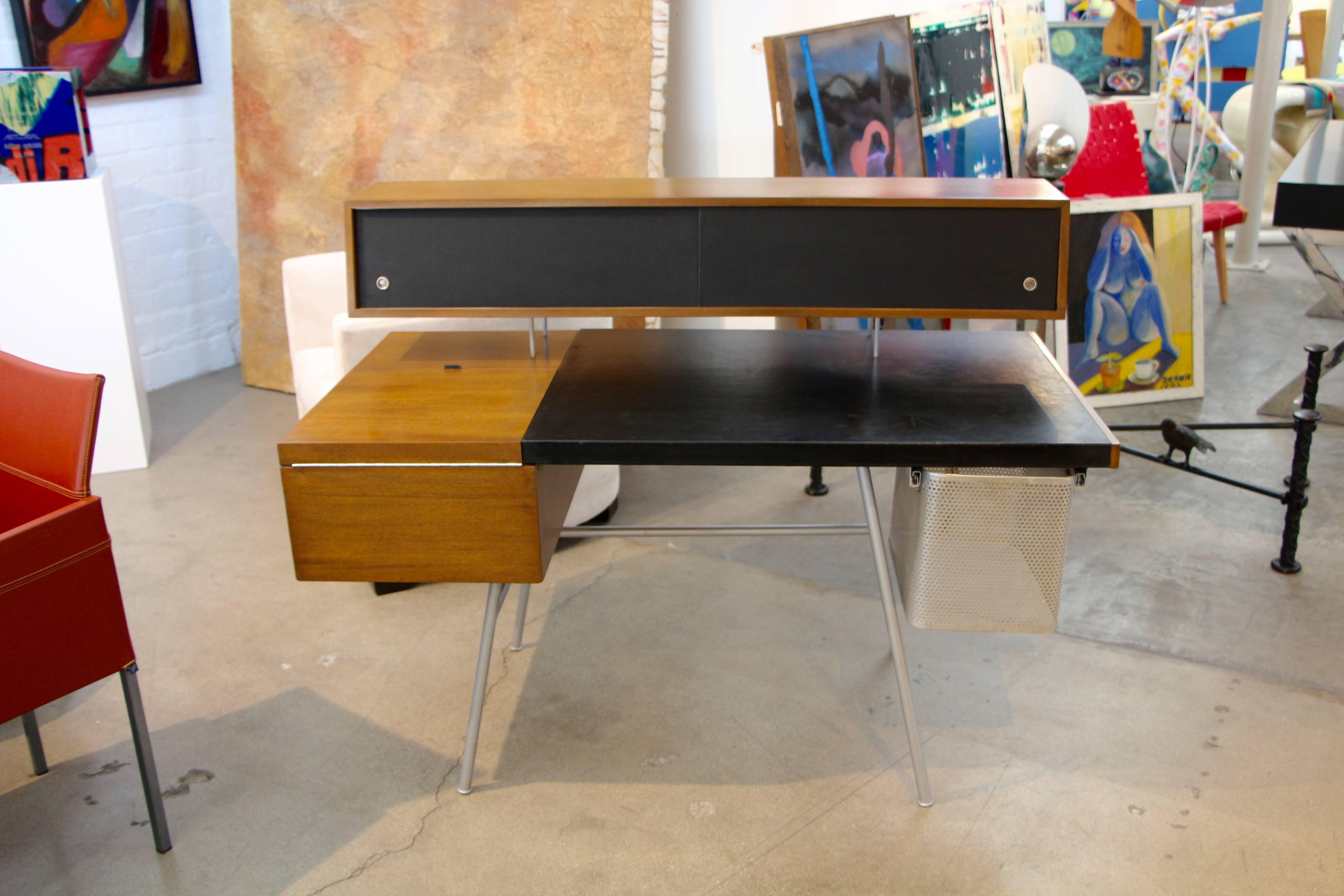 A somewhat rare executive home desk designed by George Nelson in the late 1940s. For the time it was a stunning design and is still relative today. We acquired this desk from the original owner's family and they were unsure of the exact year it was