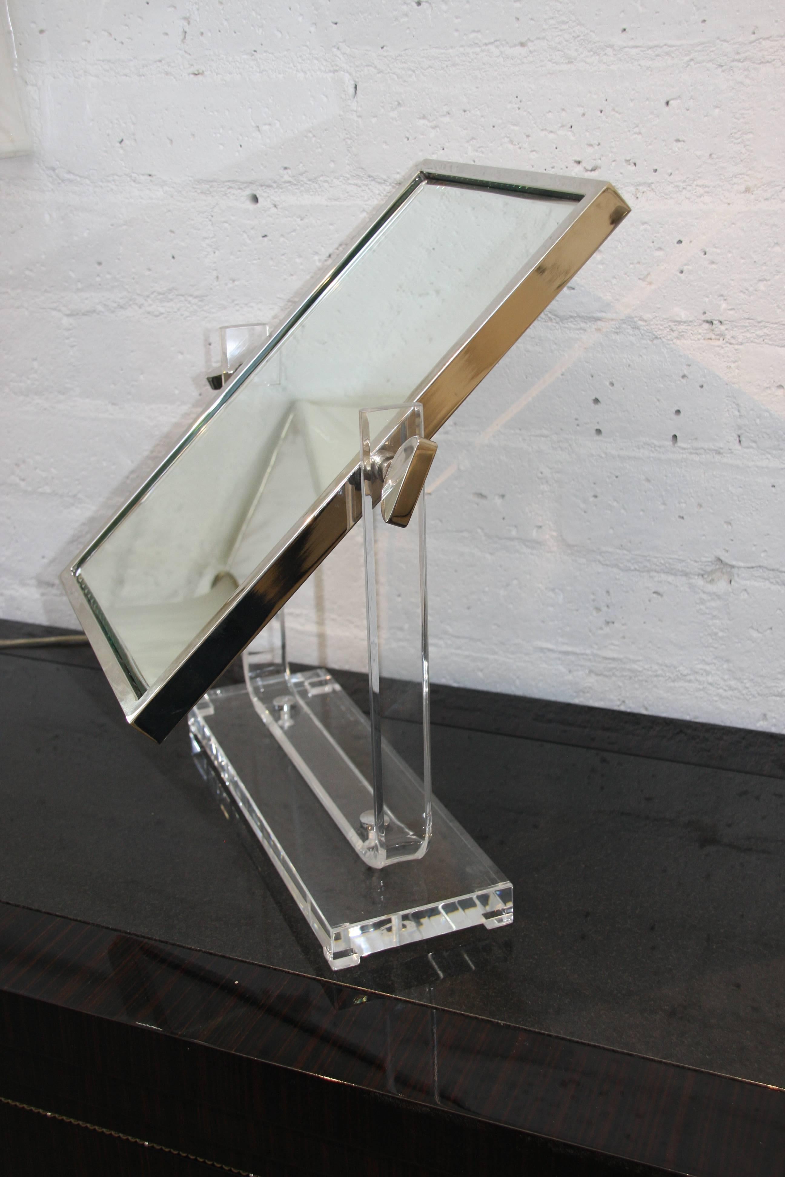 A beautiful large double sided table mirror by Charles Hollis Jones. It is etched with his signature and dated 1970.