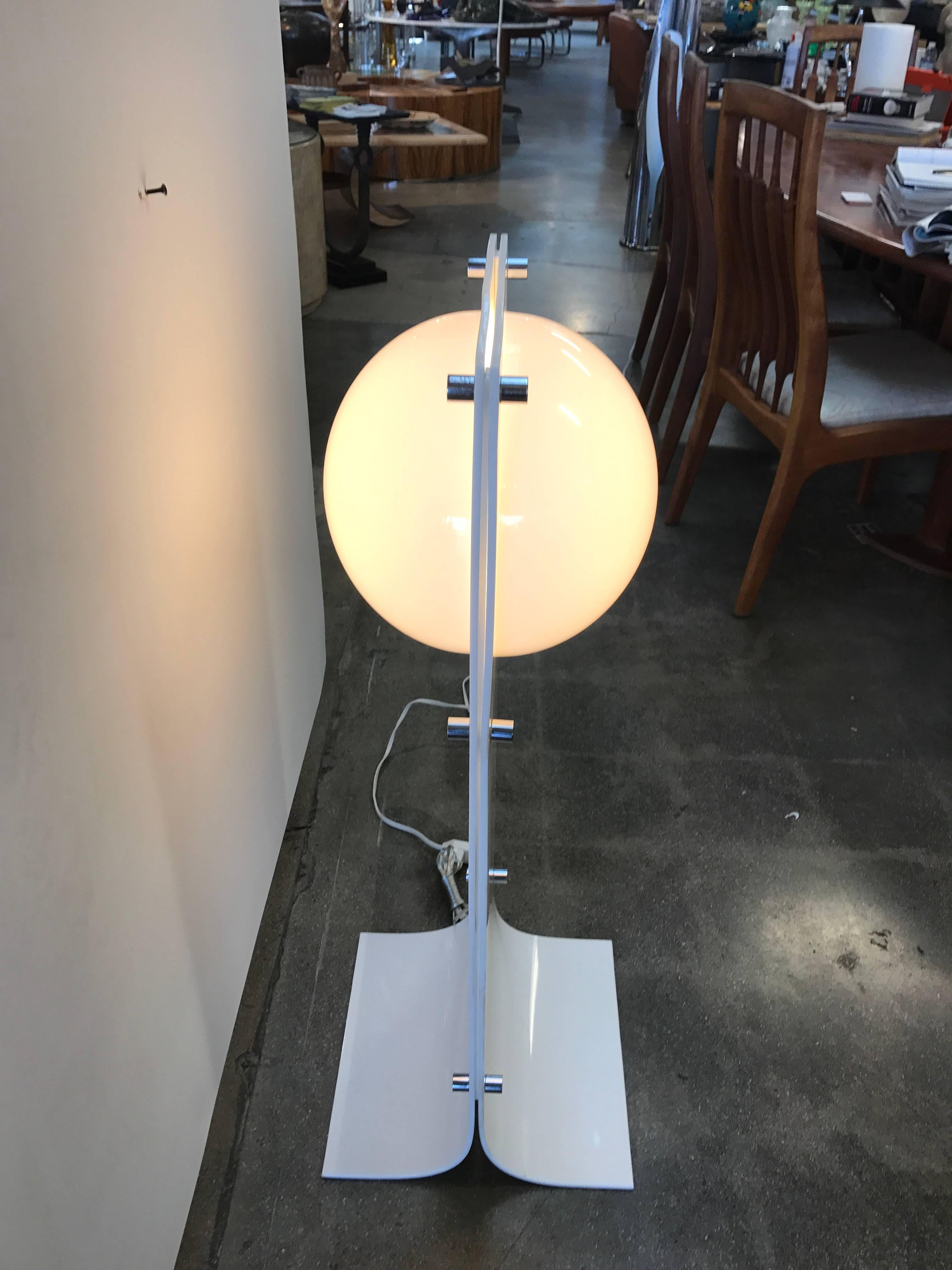 A nice vintage molded acrylic lamp designed by Neal Small. It has been cleaned and re-wired. With the chrome pieces cleaned as best as possible. There are some age appropriate wear with minor surface scratches and imperfections to the chrome but it