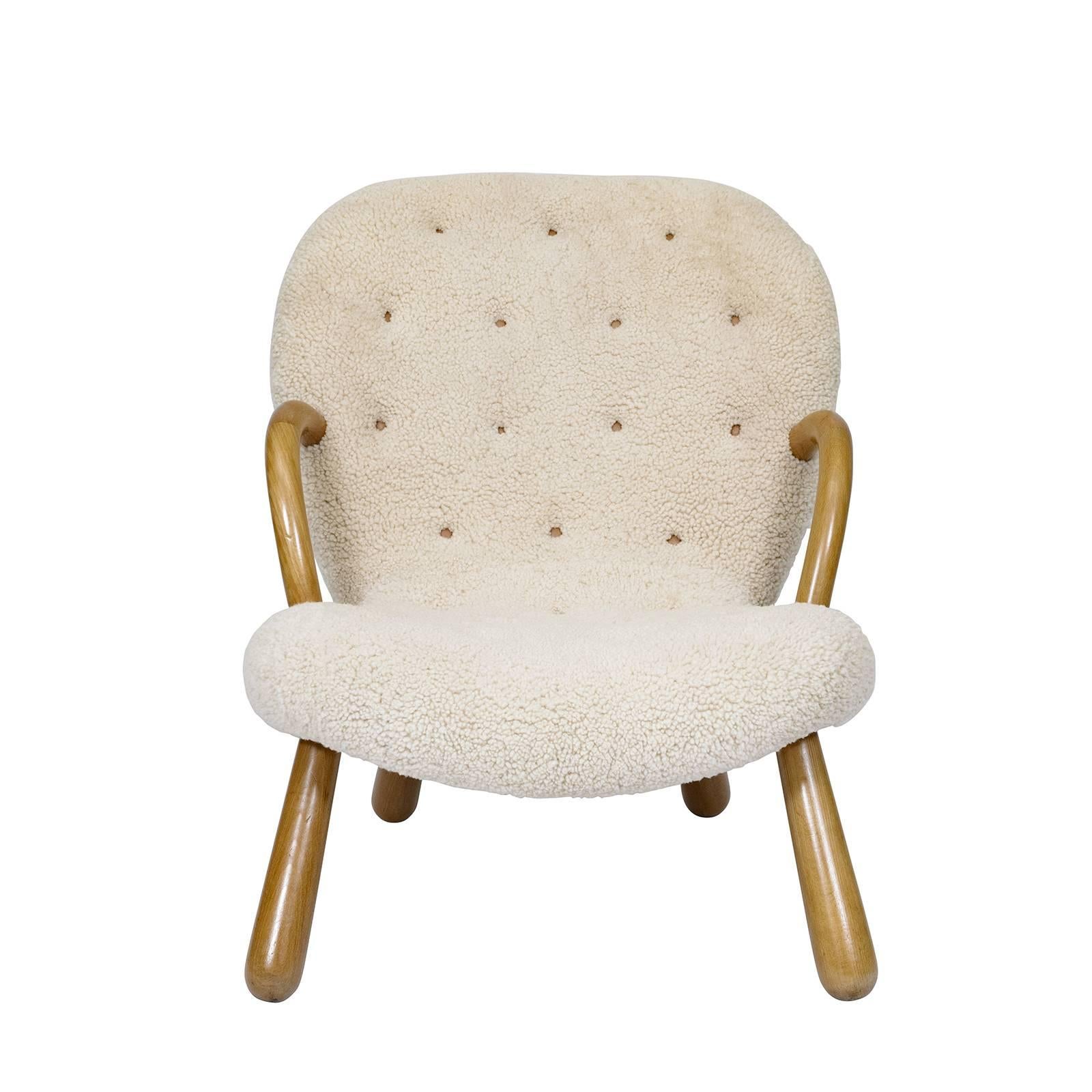 Philip Arctander "Clam" chair upholstered in sheepskin.   Store formerly known as ARTFUL DODGER INC