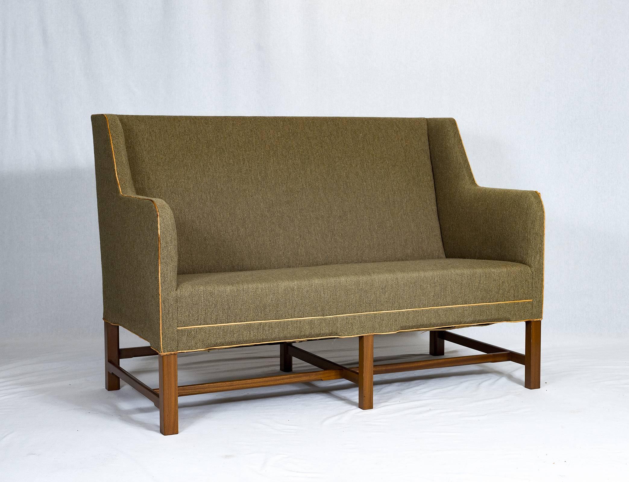Kaare Klint settee designed in 1935 and produced by Rud Rasmussen.    Store formerly known as ARTFUL DODGER INC