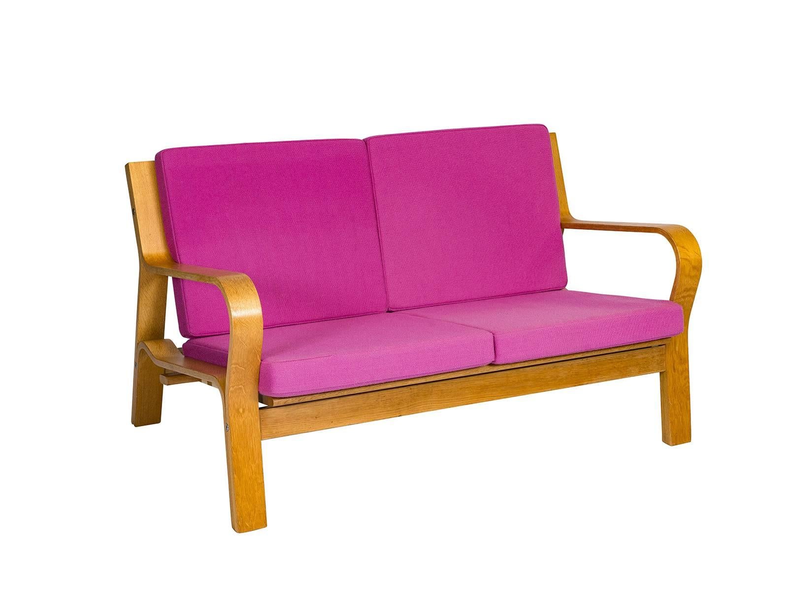 Hans Wegner GE-670 settee designed in 1967 and produced by Getama. The back is woven flag line.    Store formerly known as ARTFUL DODGER INC