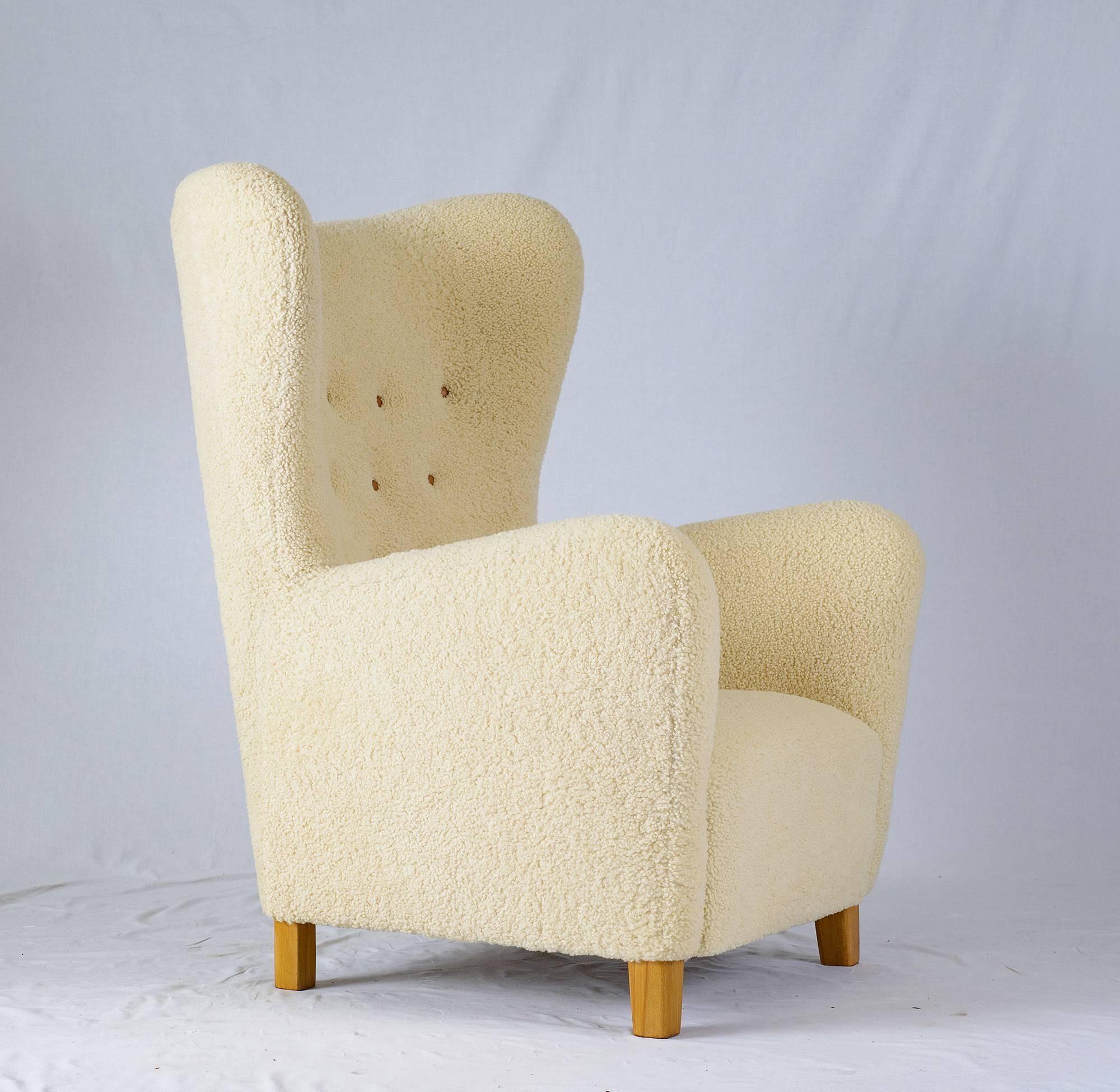 Fritz Hansen model #1672 sheepskin high back chair.  