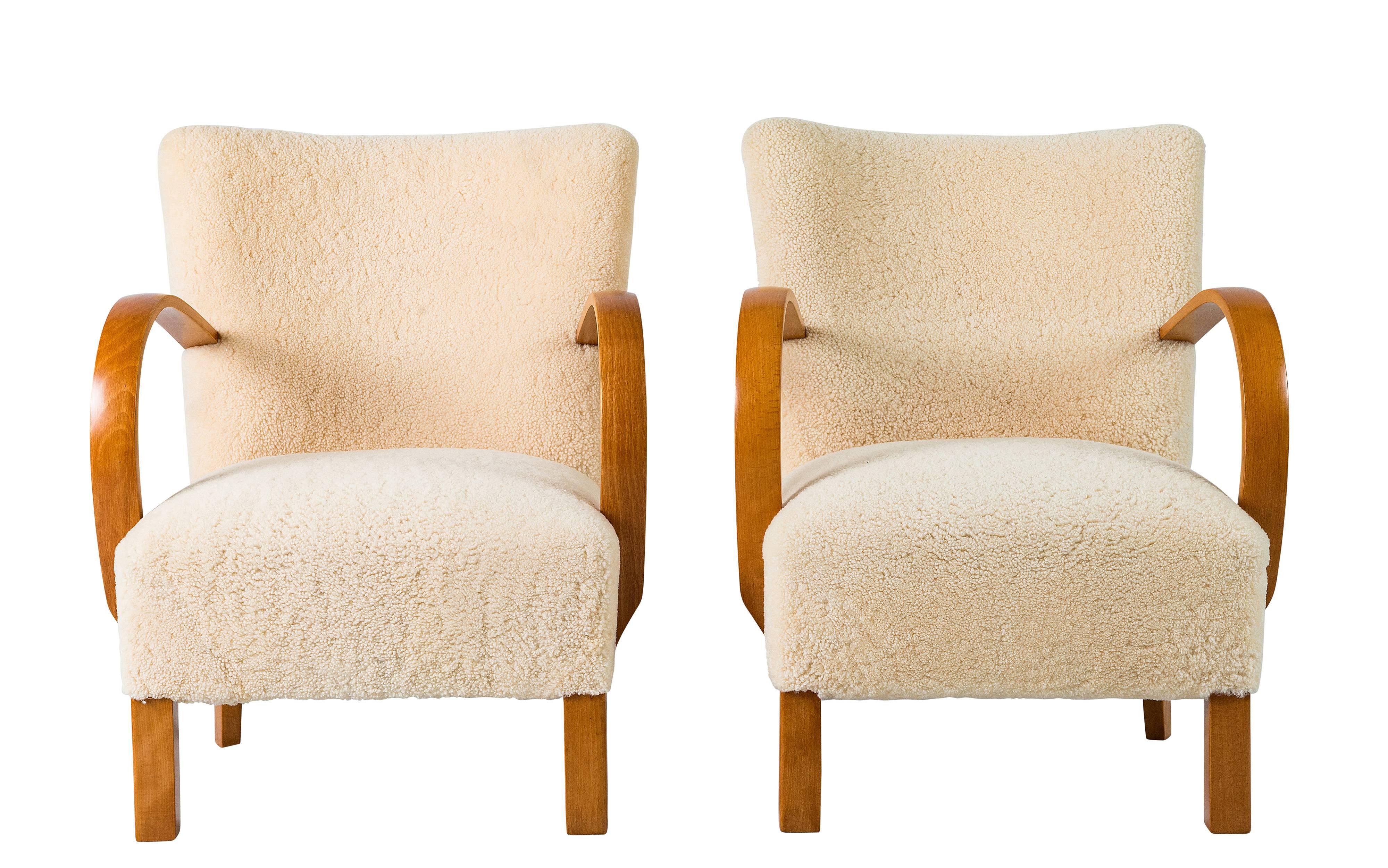 Pair of Scandinavian sheepskin lounge chairs.