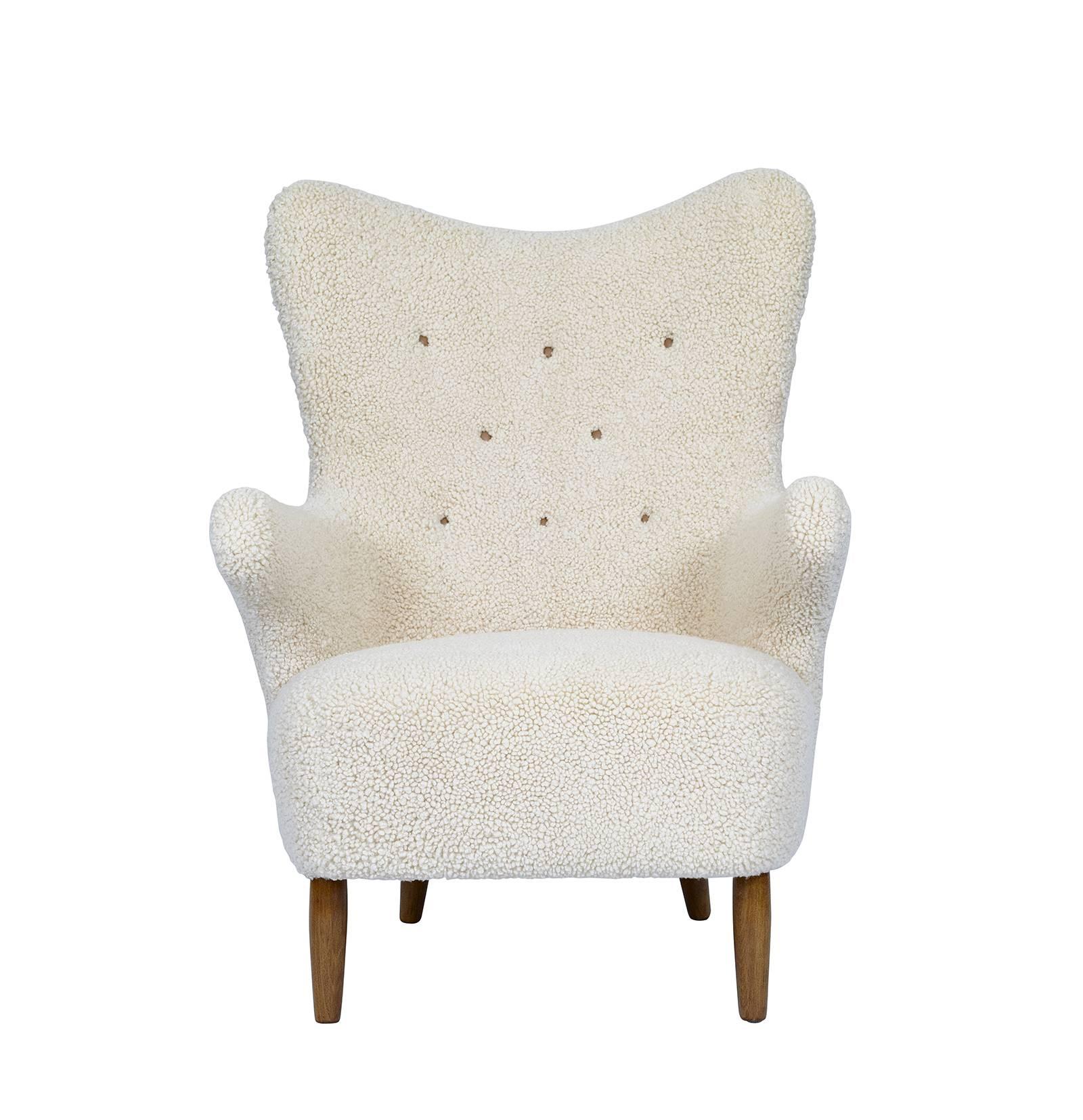 Scandinavian sheepskin lounge chair.  Search: Philip Arctander, Mogens Lassen, Flemming Lassen.
