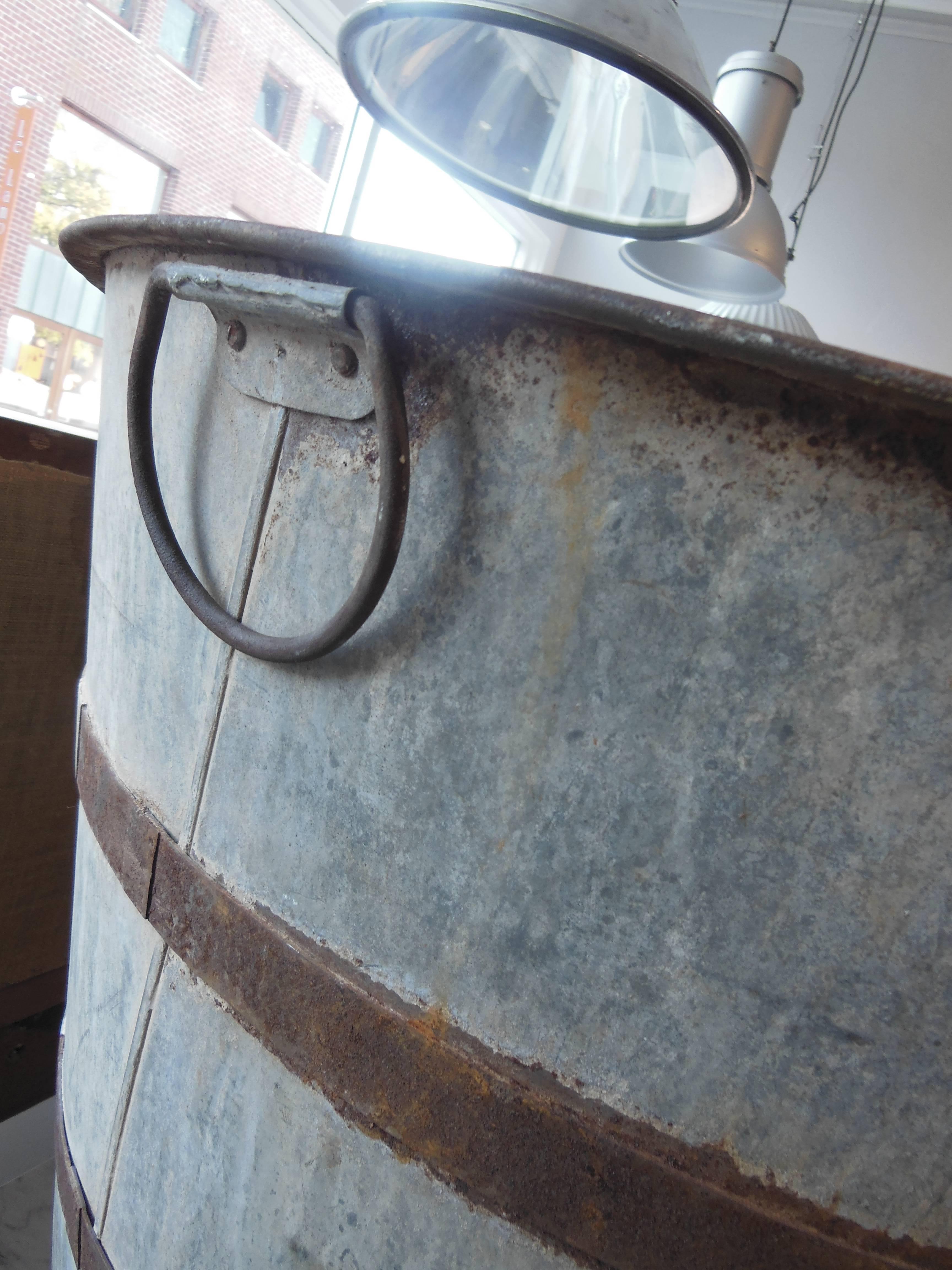 a large container with iron straps and 2 handles, great patina