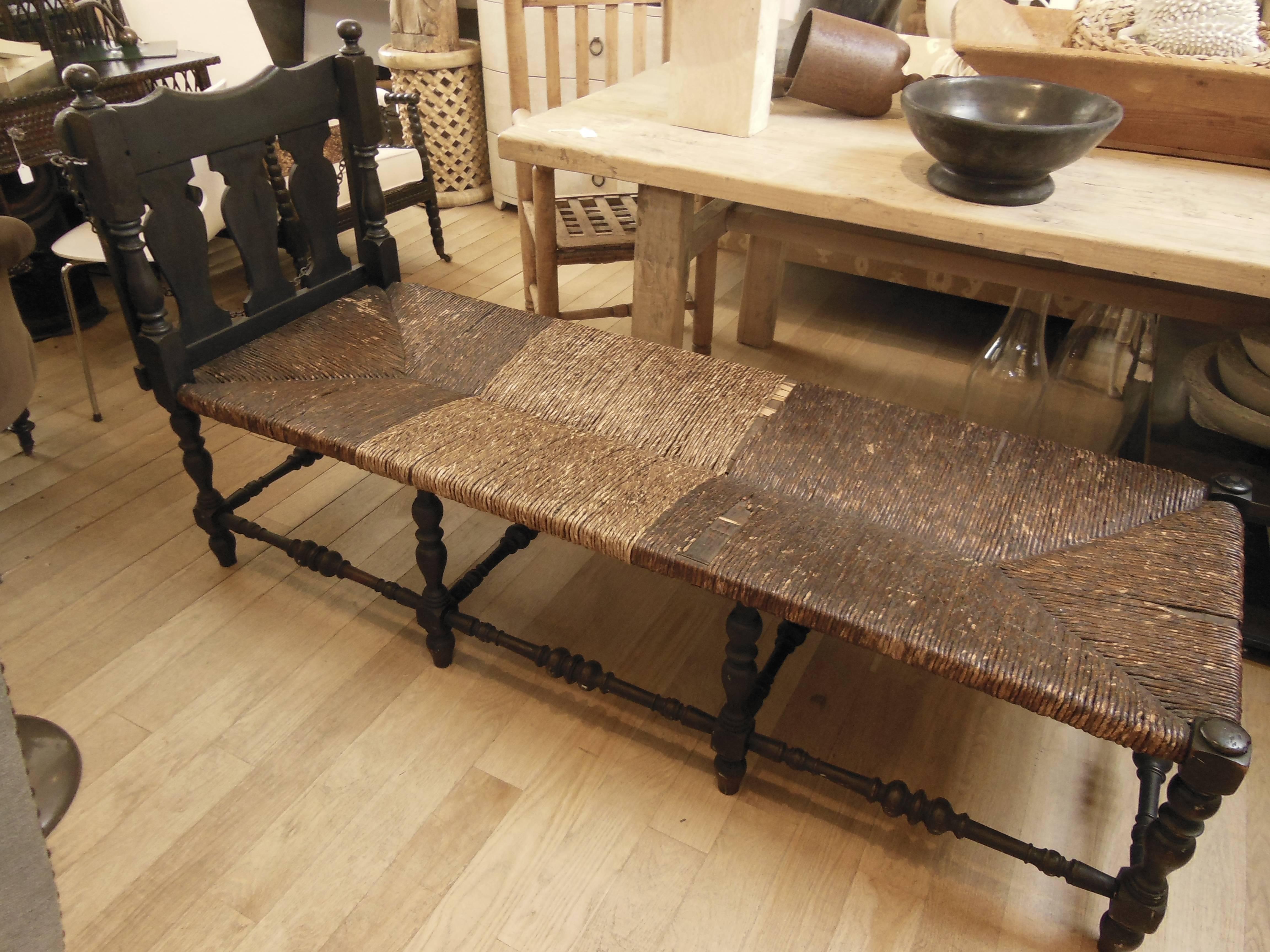 a continental bench with reclining back and rush seat  and new tufted linen cushion