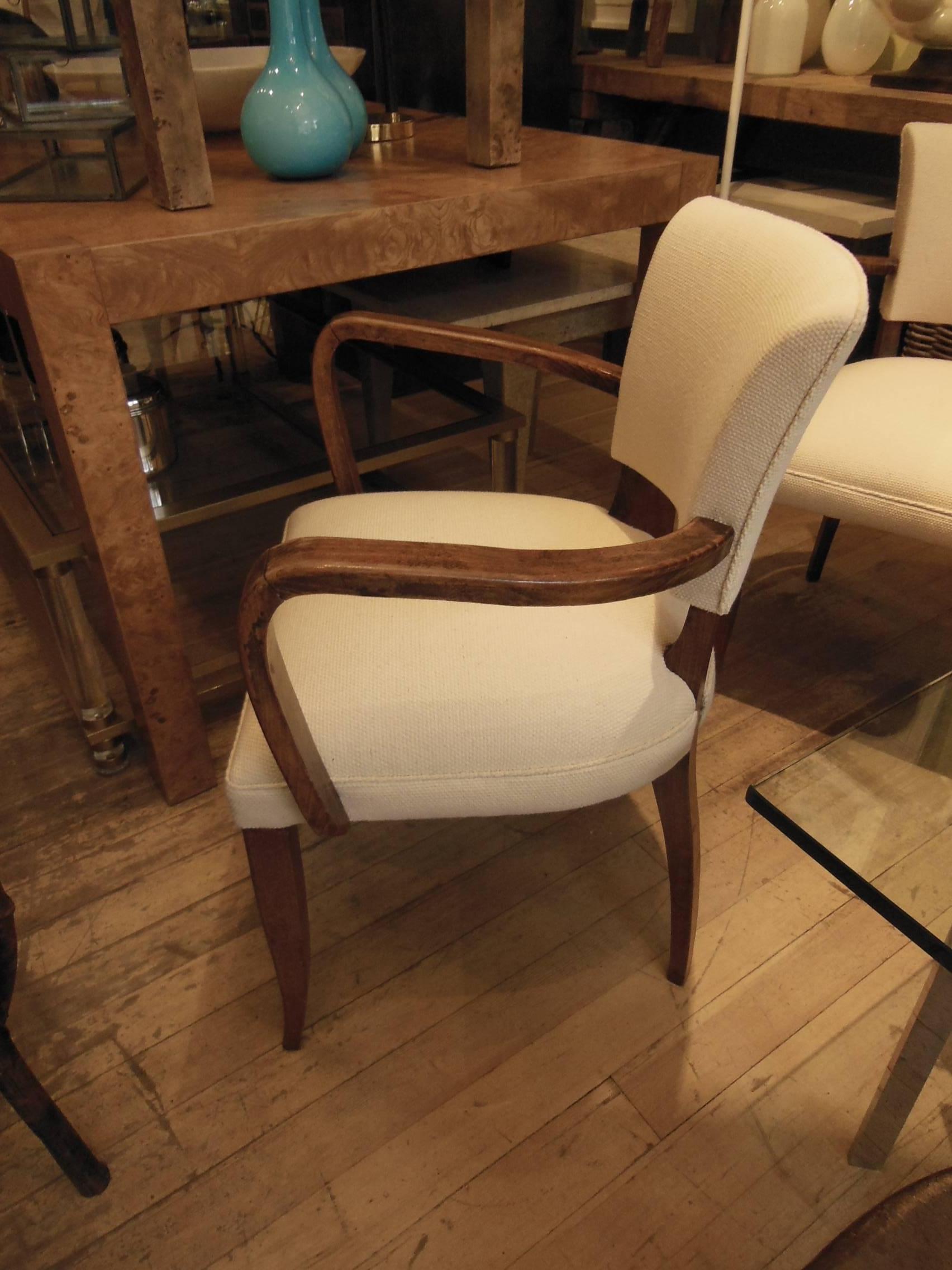 Stylish pair of armchairs newly redone in ivory linen.