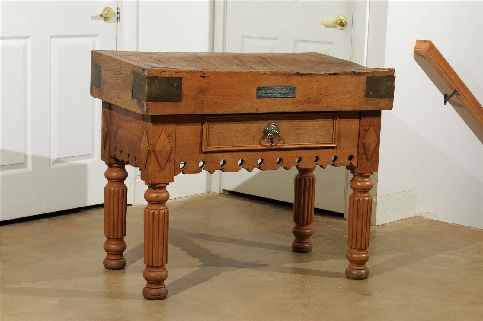 French 19th century butcher block with a single drawer. Nicely carved apron on three sides, circa 1870.