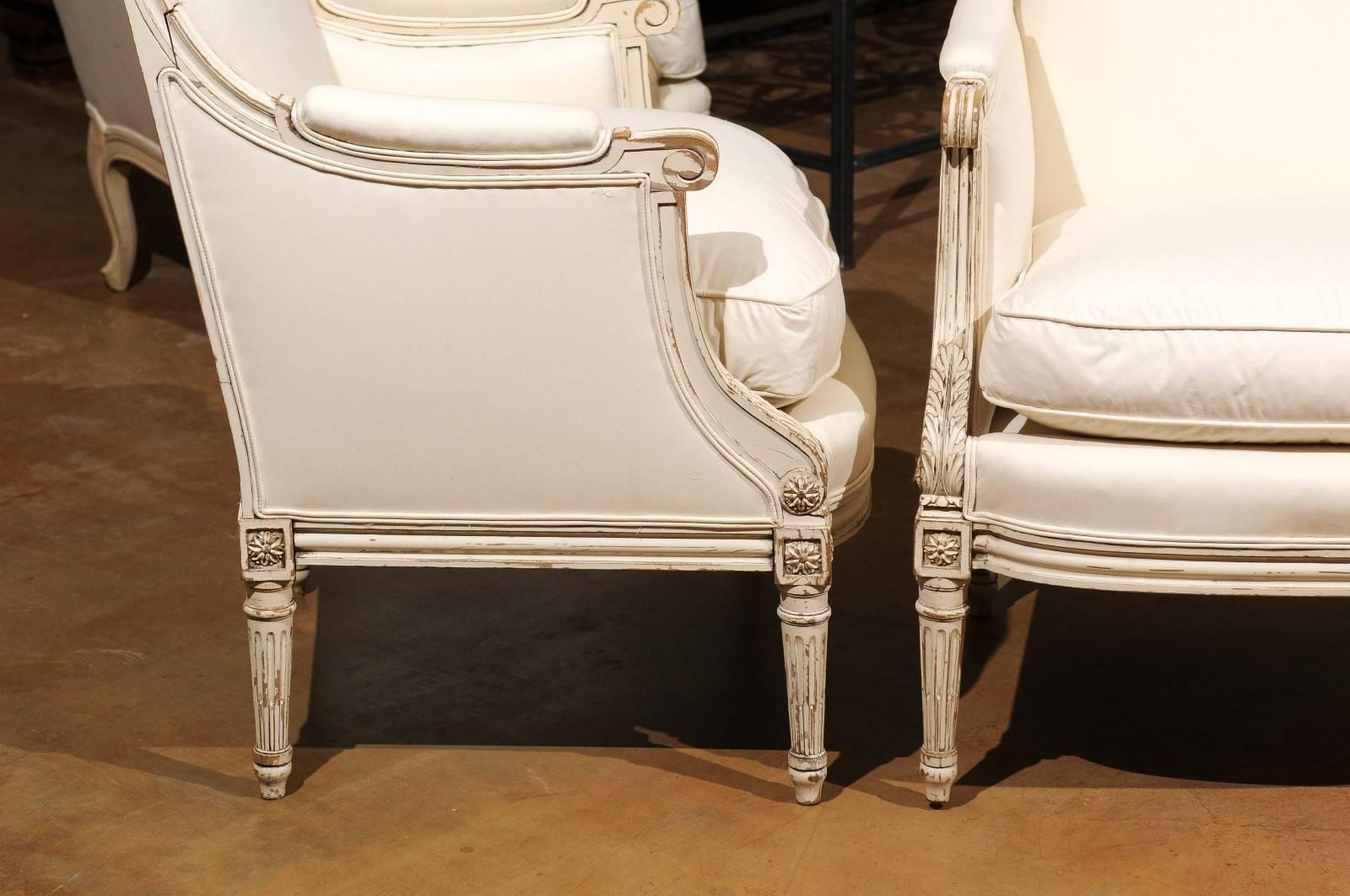 Upholstery Pair of French Louis XVI Style 1910s Bergère Chairs with Light Painted Finish