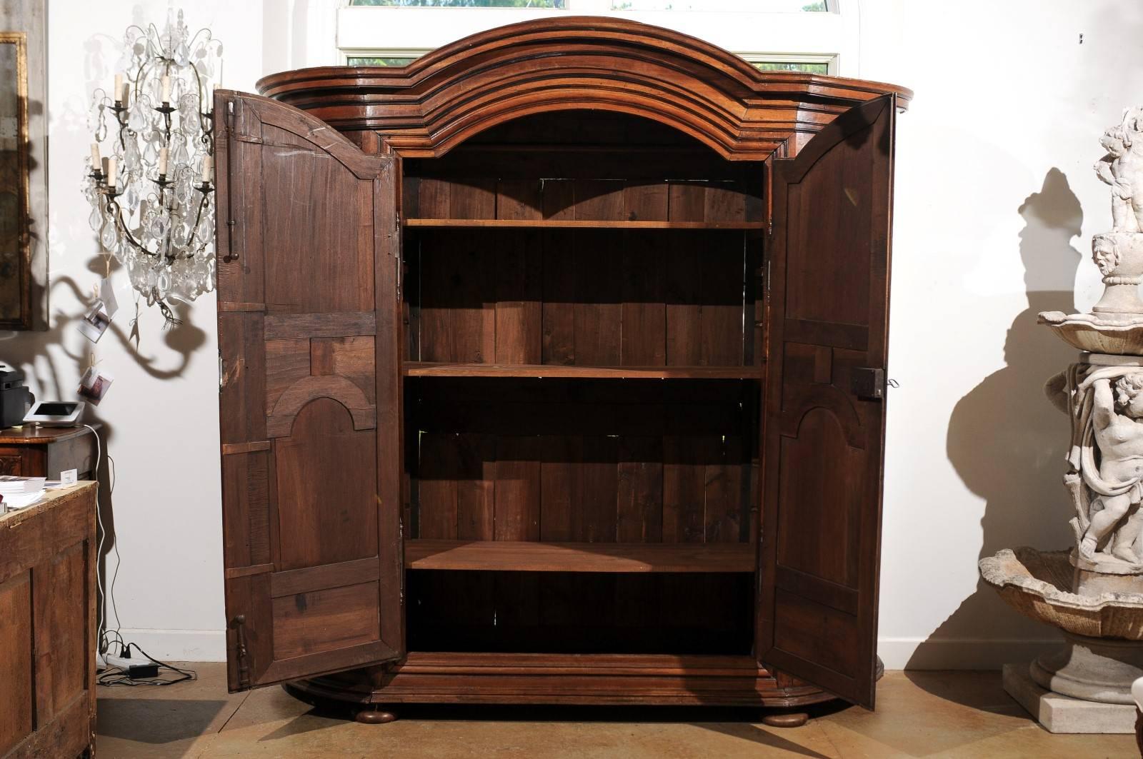 French 1820s Louis XIII Style Carved Walnut Armoire with Curved Open Shelves In Good Condition In Atlanta, GA